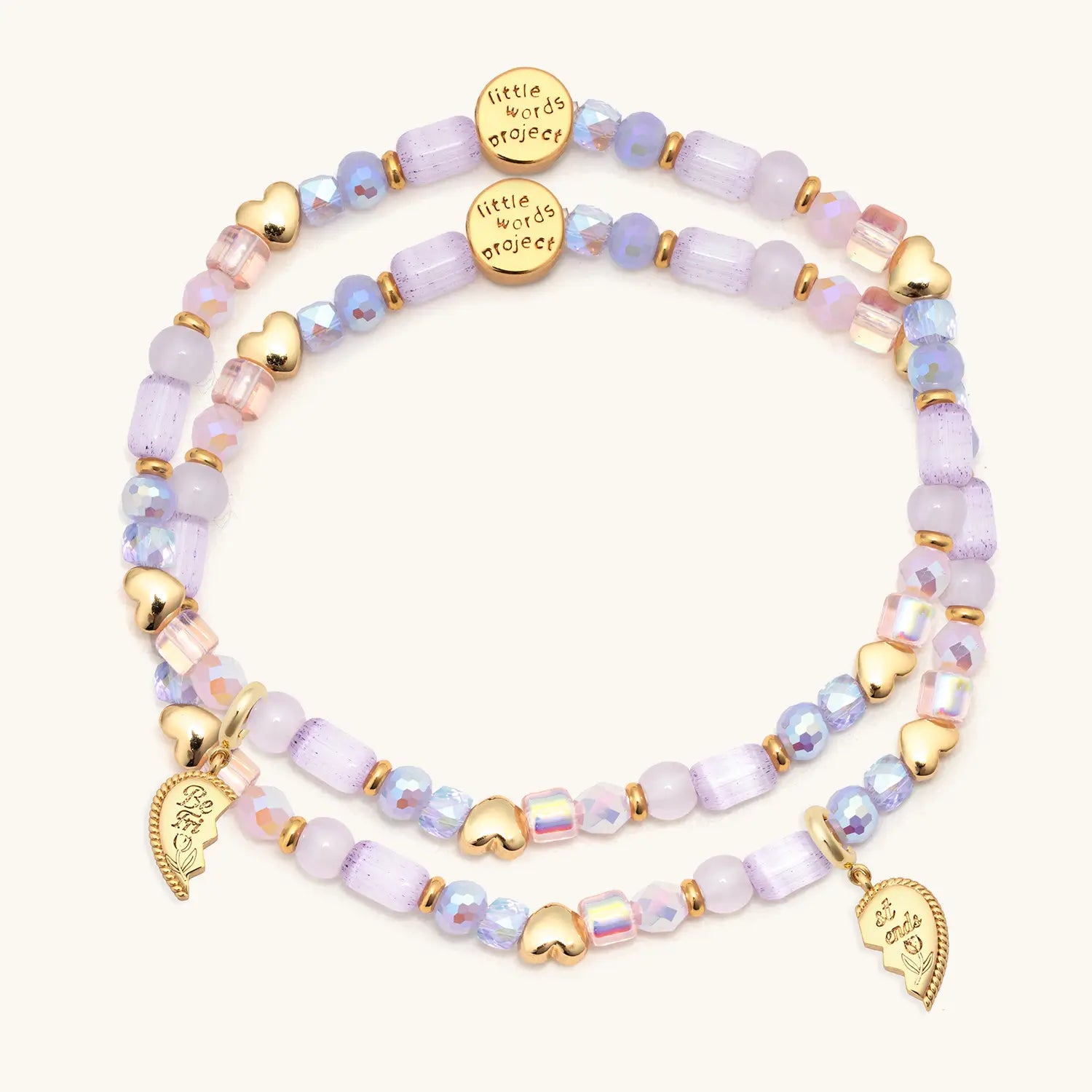 Set of beaded bracelets with gold accents on a white background
