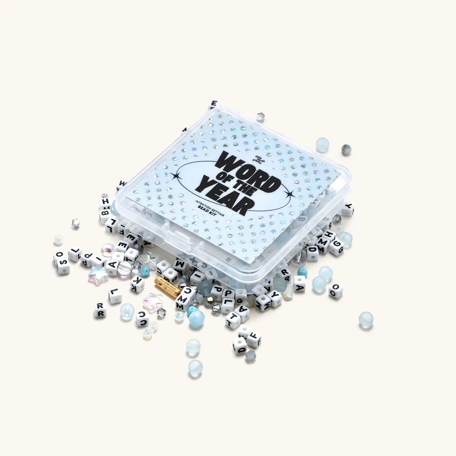 Container of letter cubes with 'Word of the Year' text on a white background