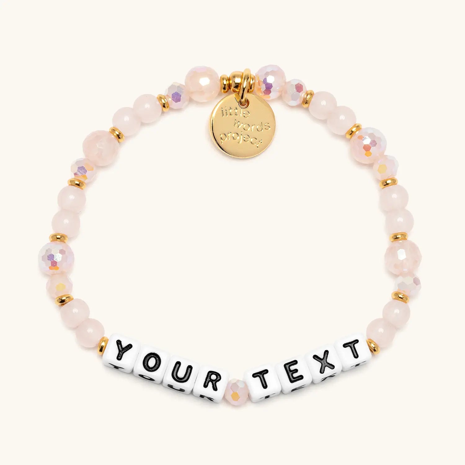 Custom Sweetums bracelet with soft pink crystal and glass beads and white letter beads reading Your Text