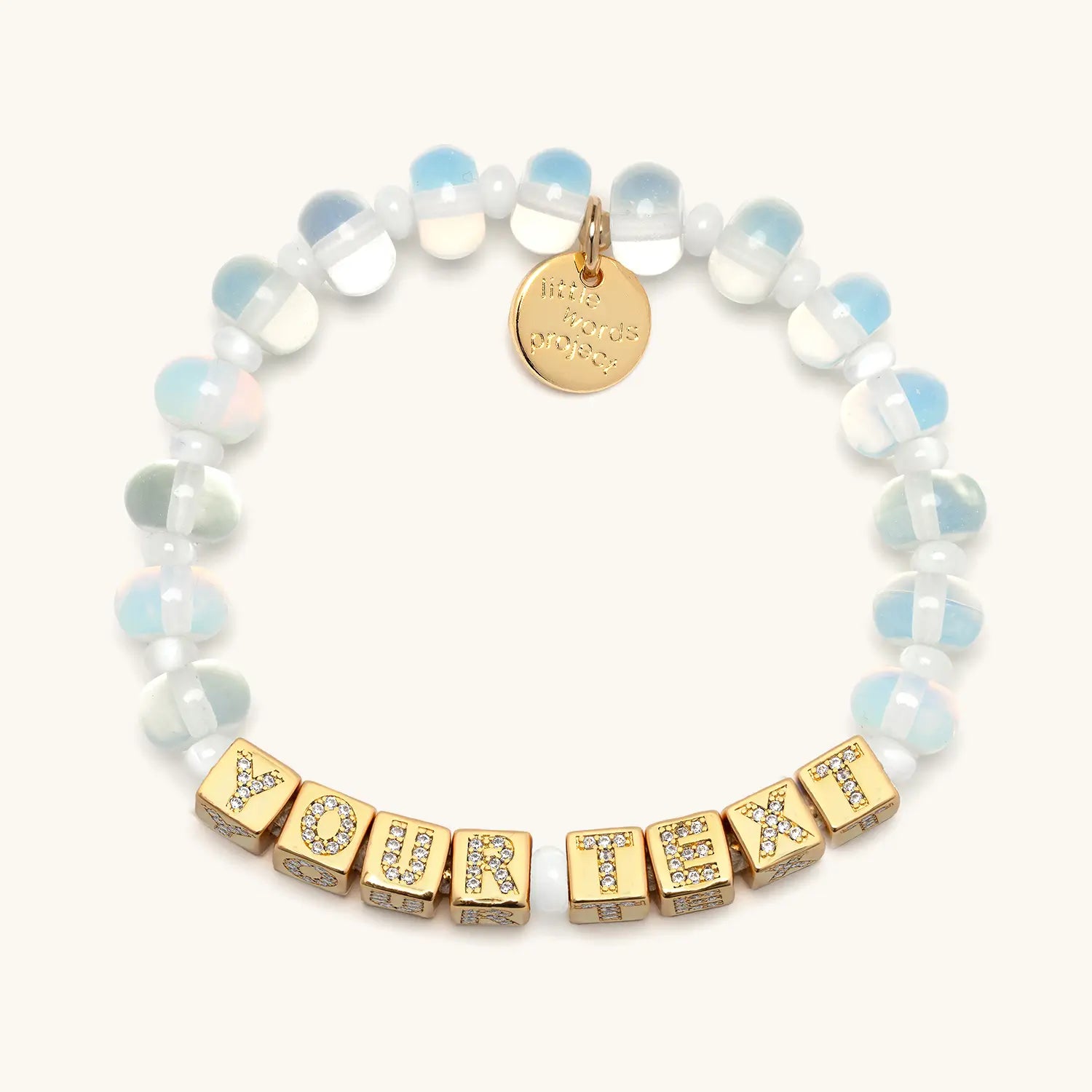 Bracelet with gold letter beads spelling 'YOUR TEXT' on a white background