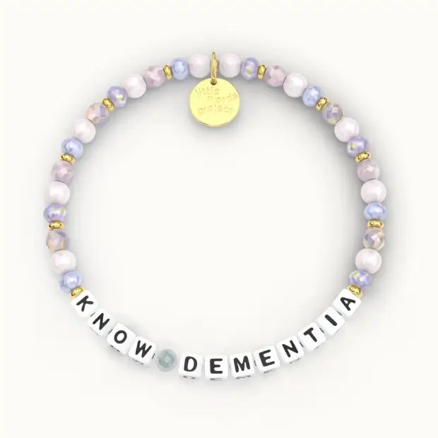 Giveback Know Dementia bracelet with lavender and periwinkle iridescent crystal beads, gold hardware, flat-lay product shot