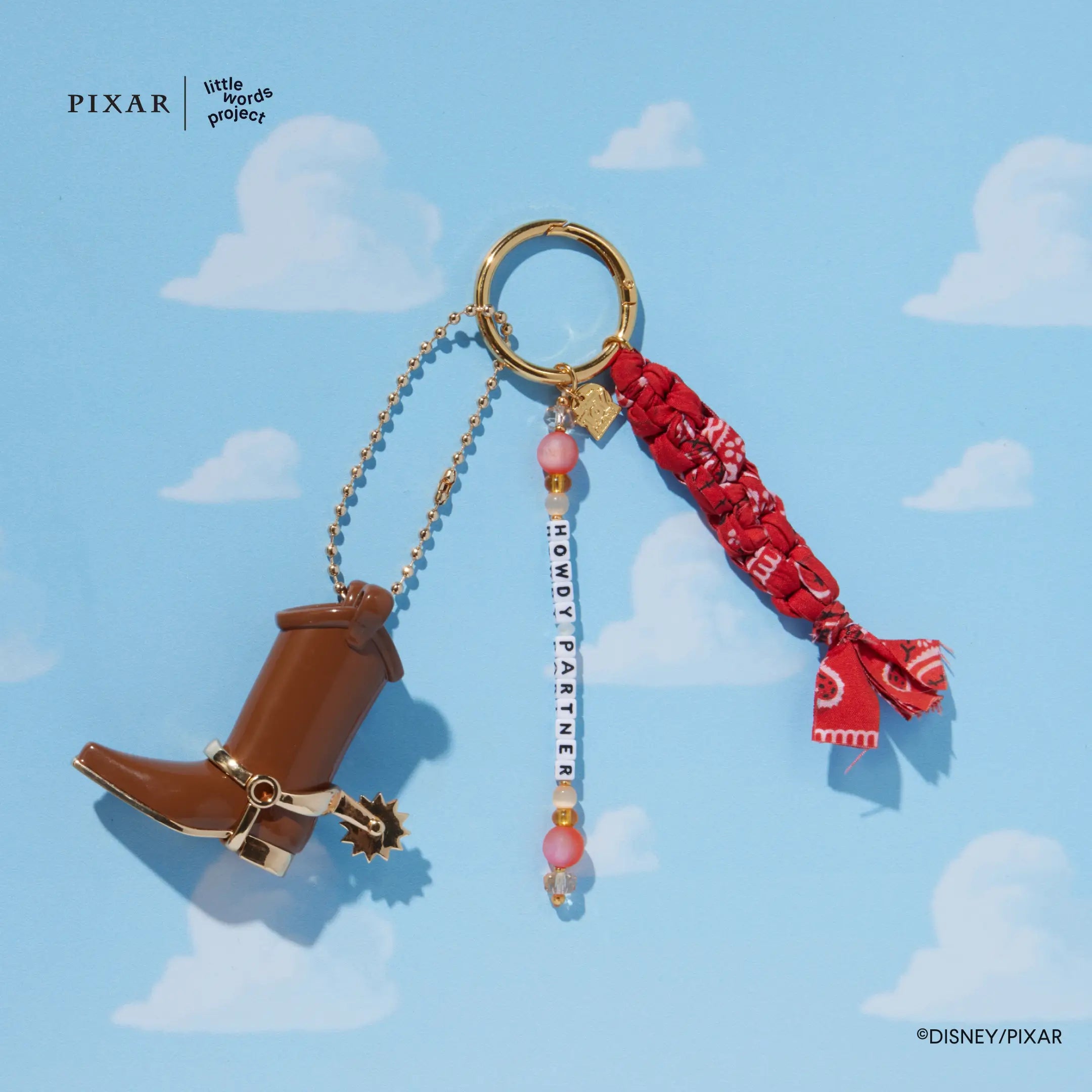 Howdy Partner Toy Story cowboy boot bag charm on a blue sky background