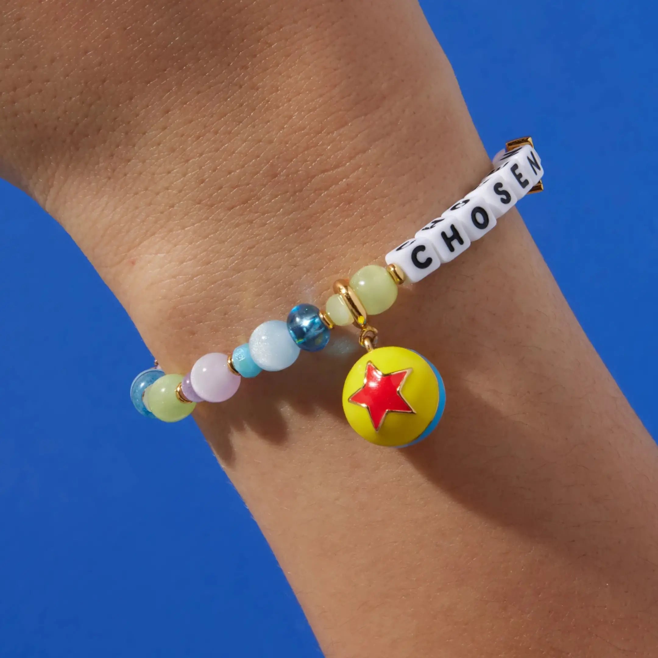 Reach for the Sky charm set, Pixar ball charm on a Chosen Toy Story bracelet, on a wrist