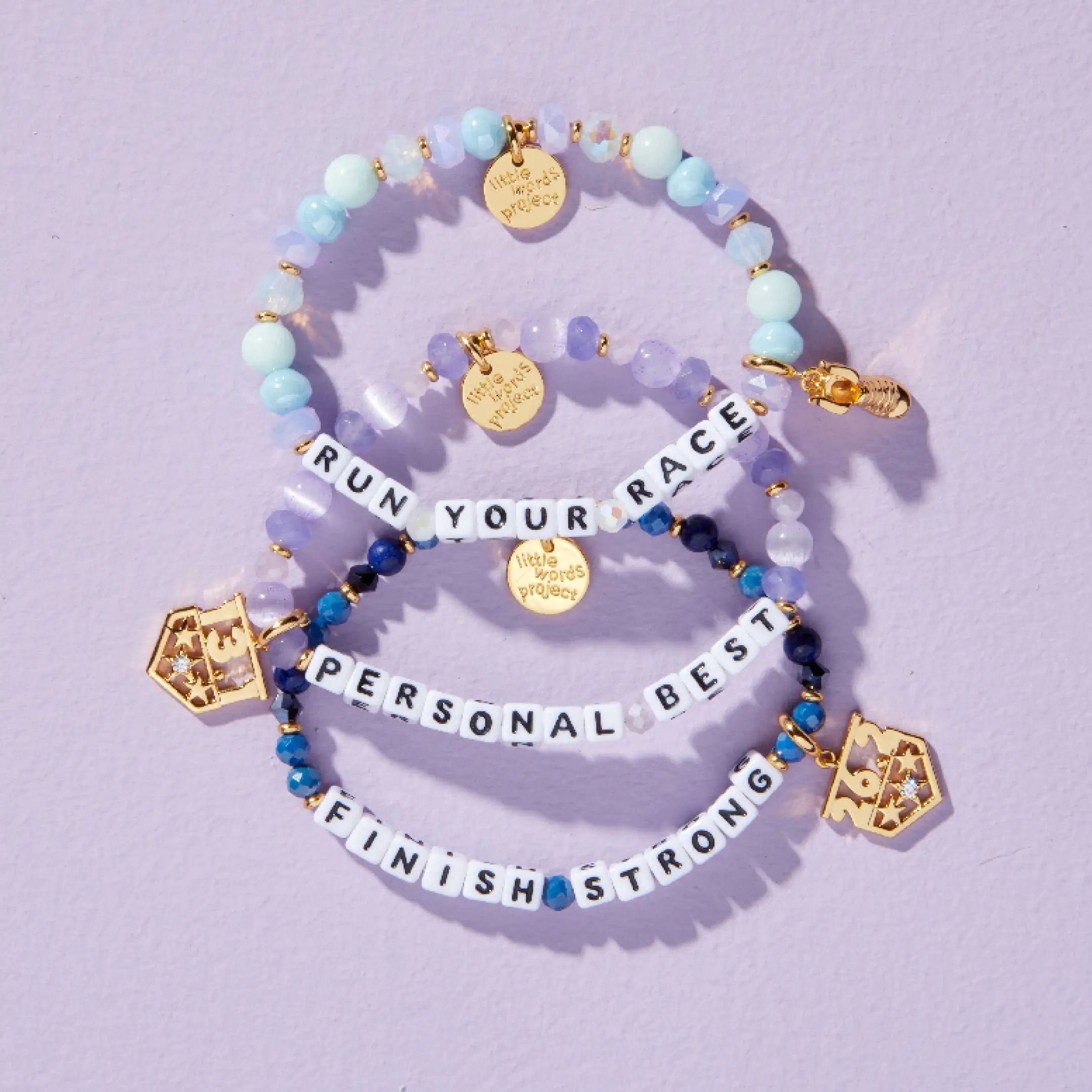 Little Words Project Global Run Day bracelet and charm collection, group lifestyle shot