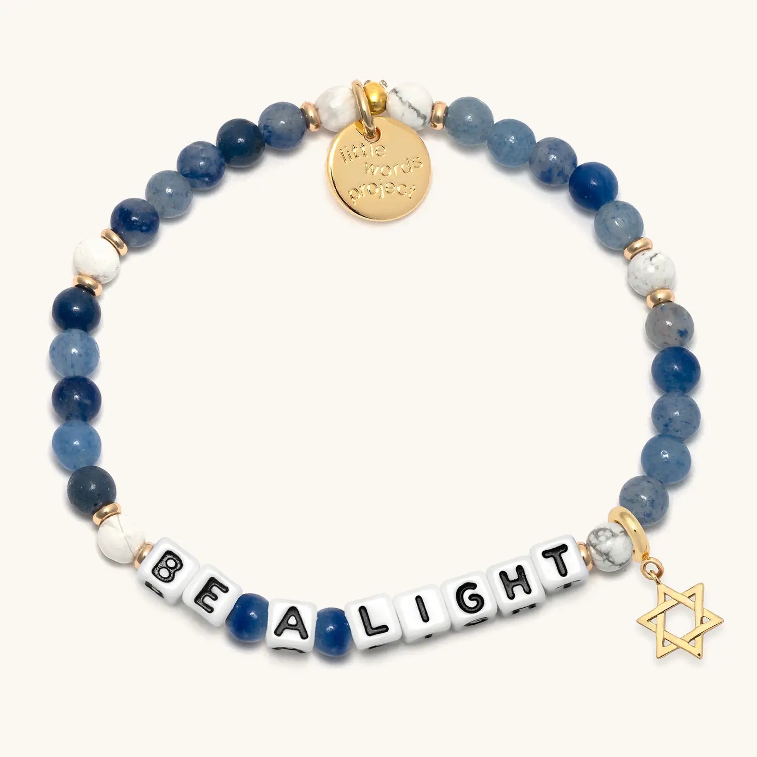 Bracelet with blue and white beads, gold charm, and 'Be A Light' message on a white background