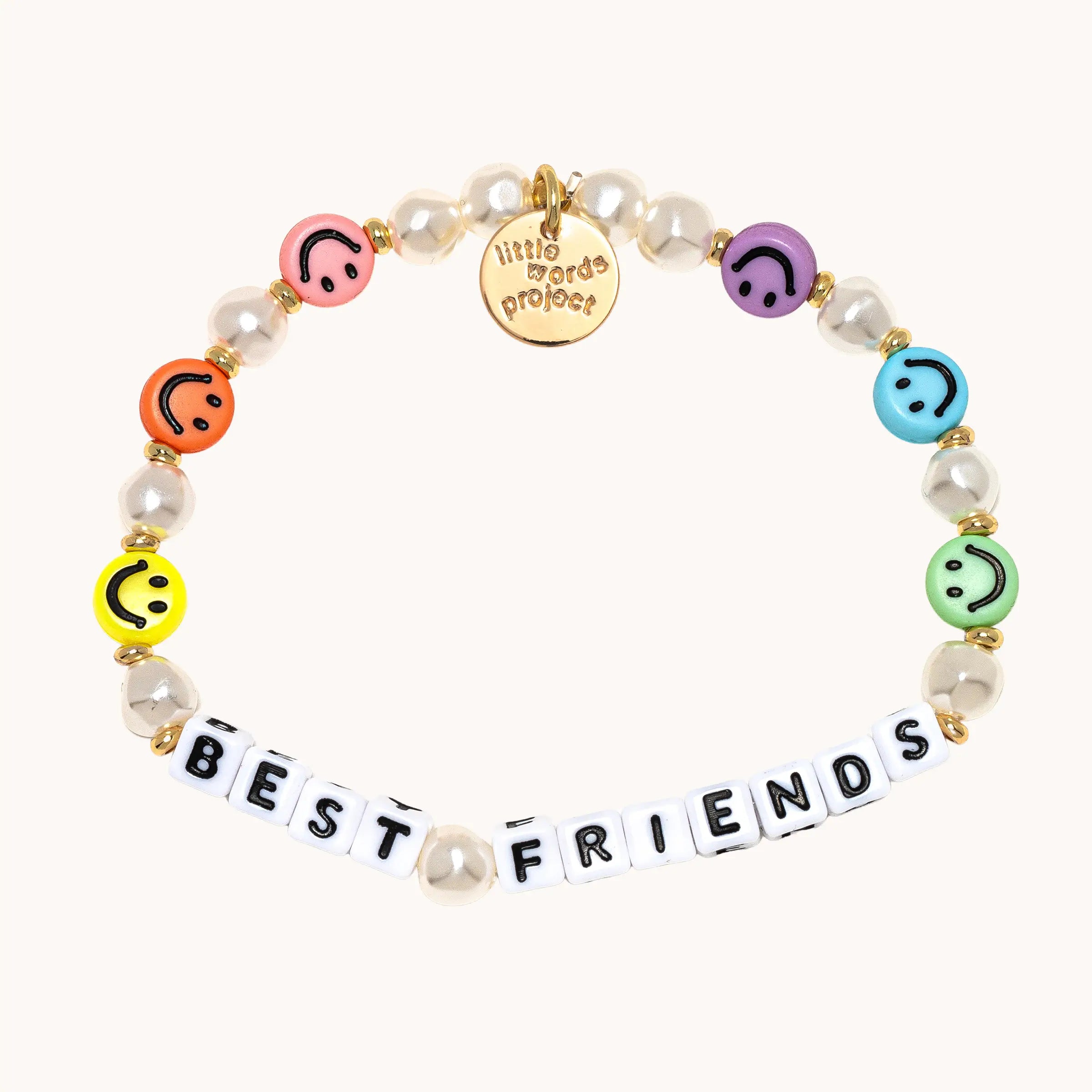 Bracelet with smiley face beads and 'BEST FRIENDS' letters on a white background