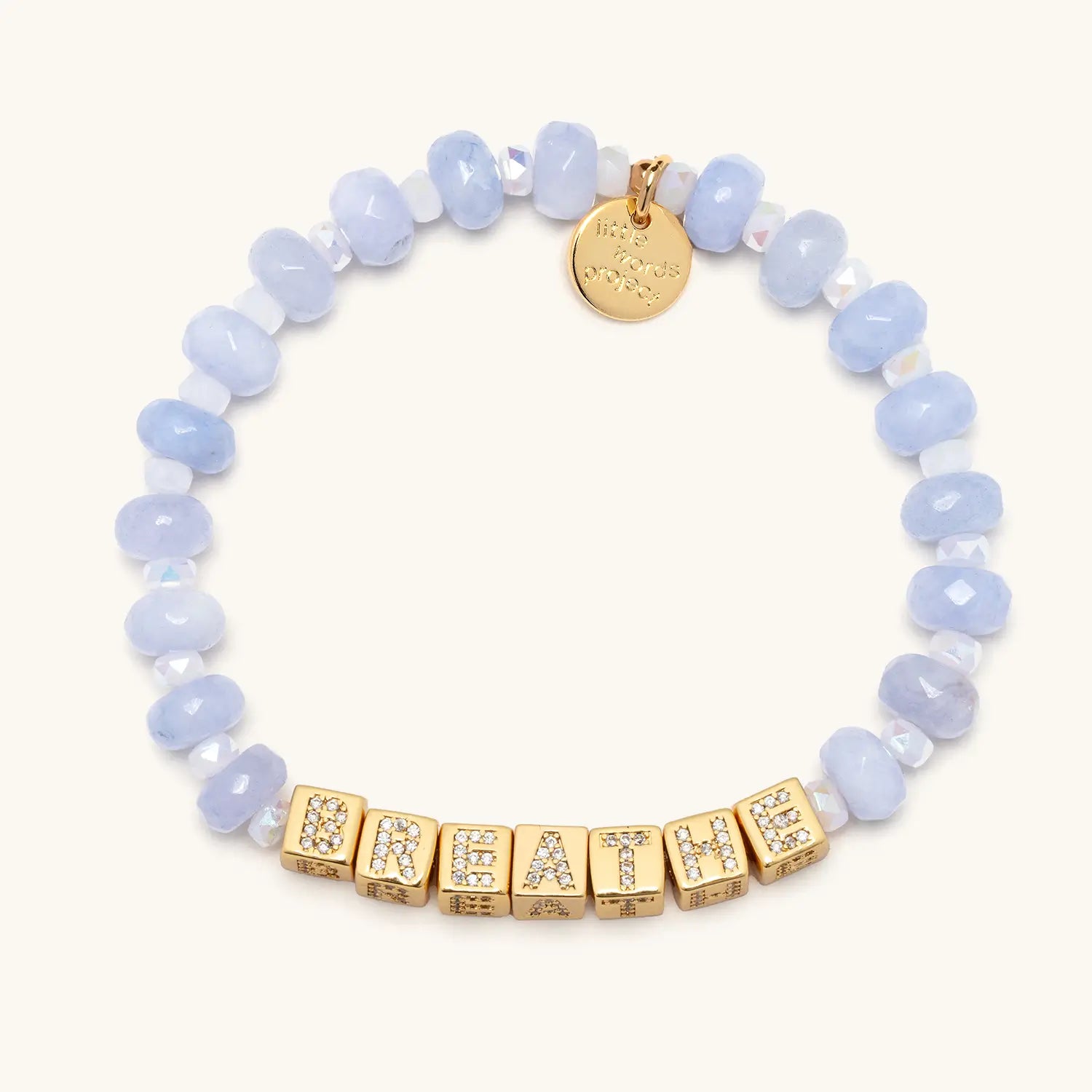Bracelet with light blue beads and gold lettered beads on a white background