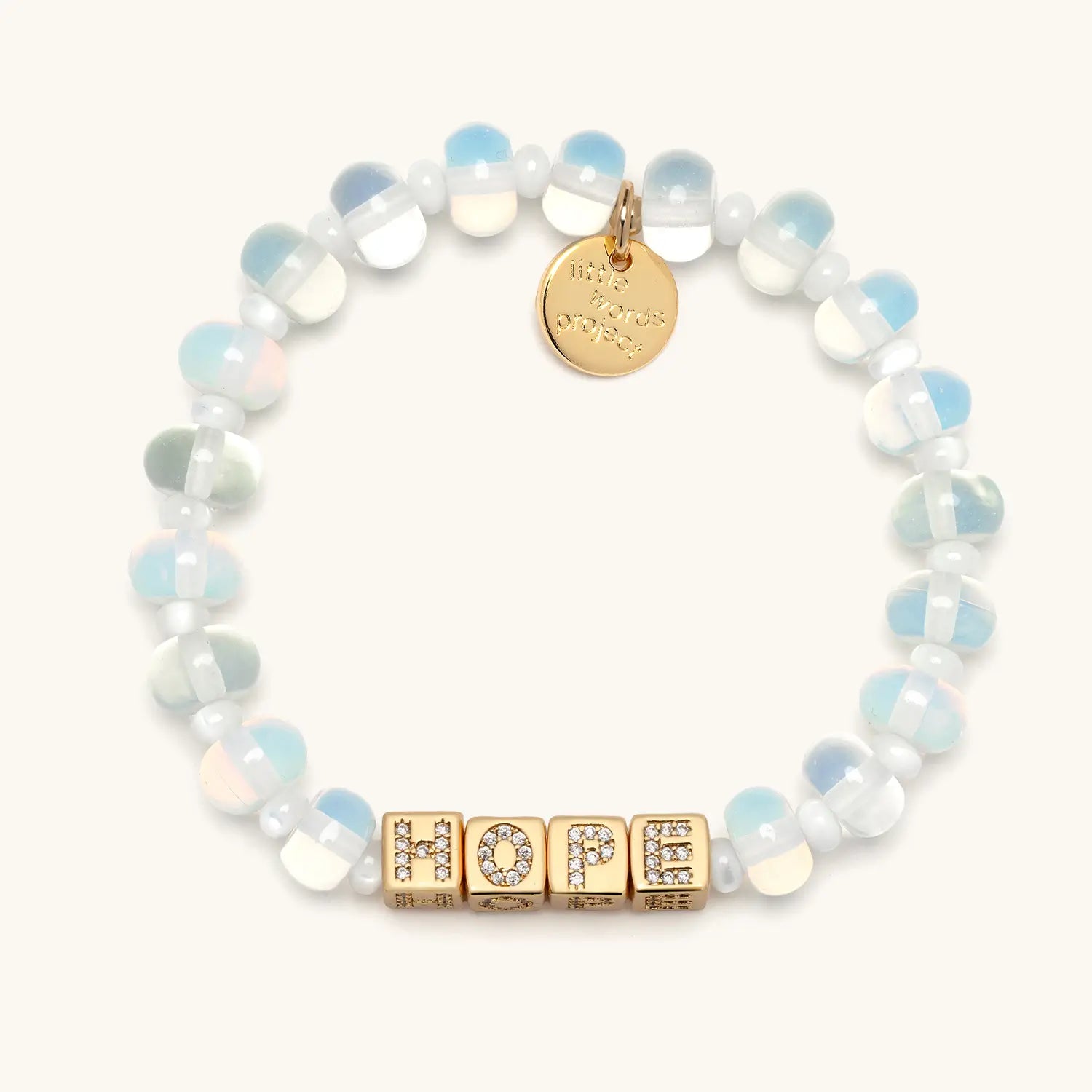 Bracelet with clear beads and gold 'HOPE' on a white background