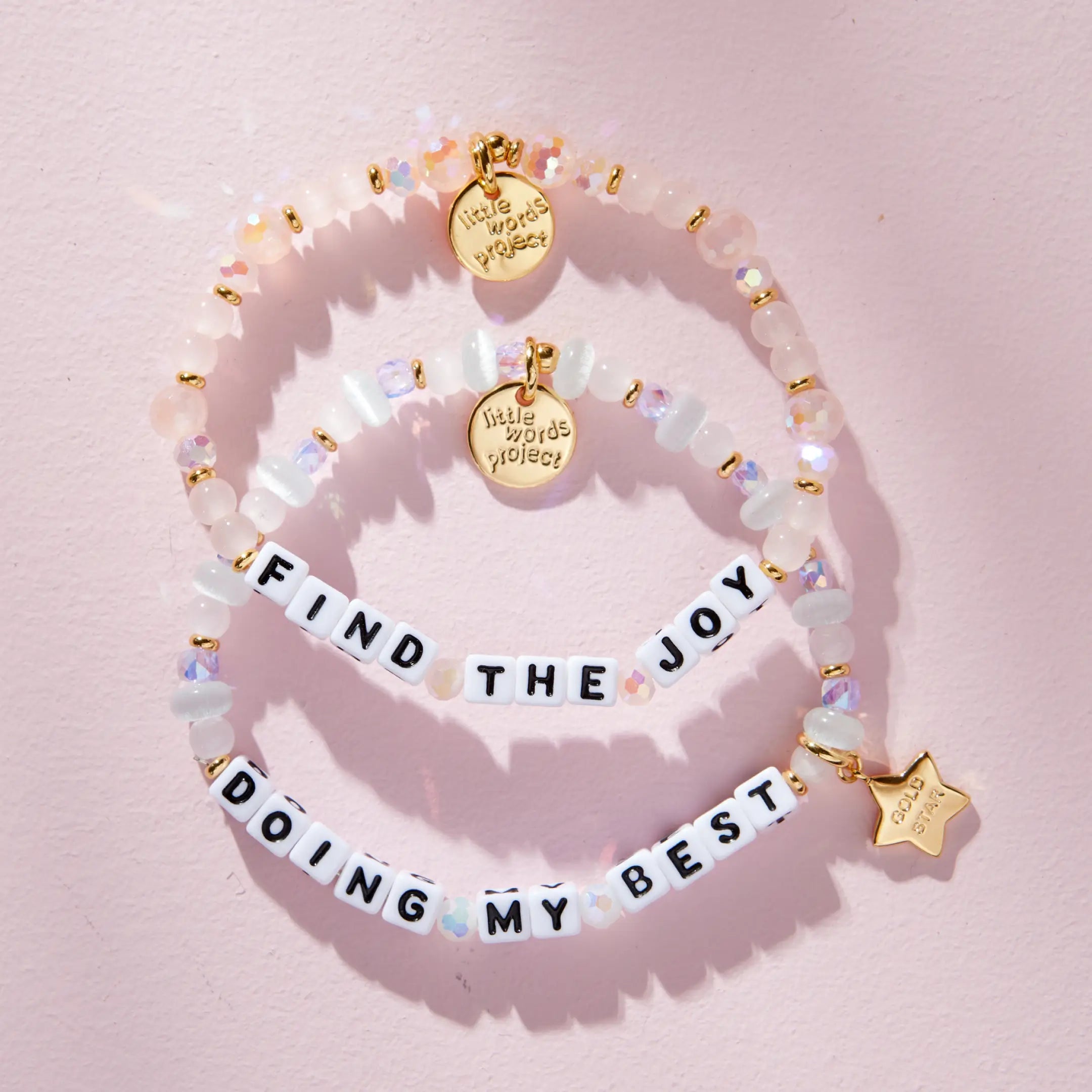 Daydreamer Bracelet Set stacked, flat lay on pink