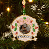 Personalized Christmas ornament with family photo on a decorated tree