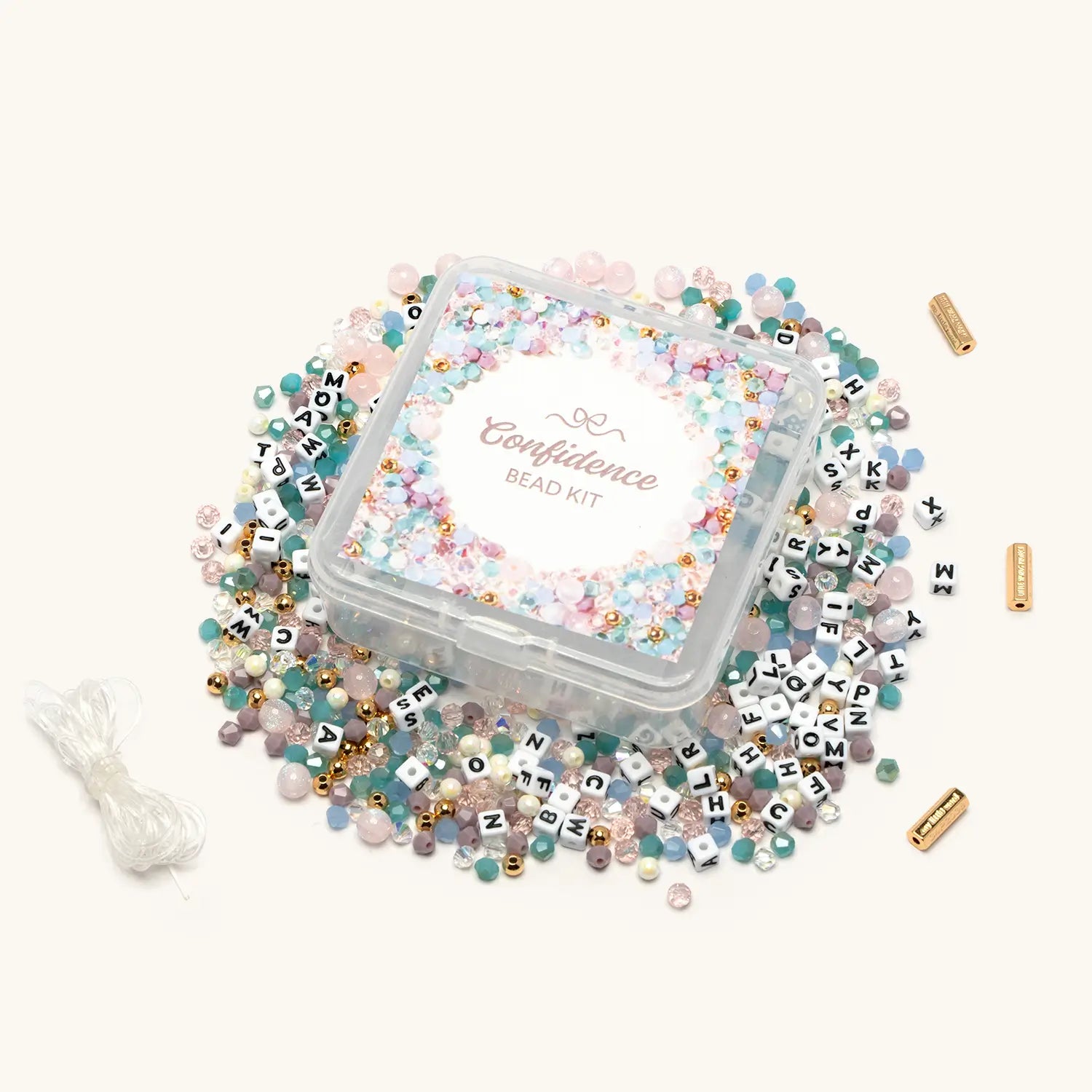 Confidence Bead Kit with pastel multi-color beads spilled around clear storage box