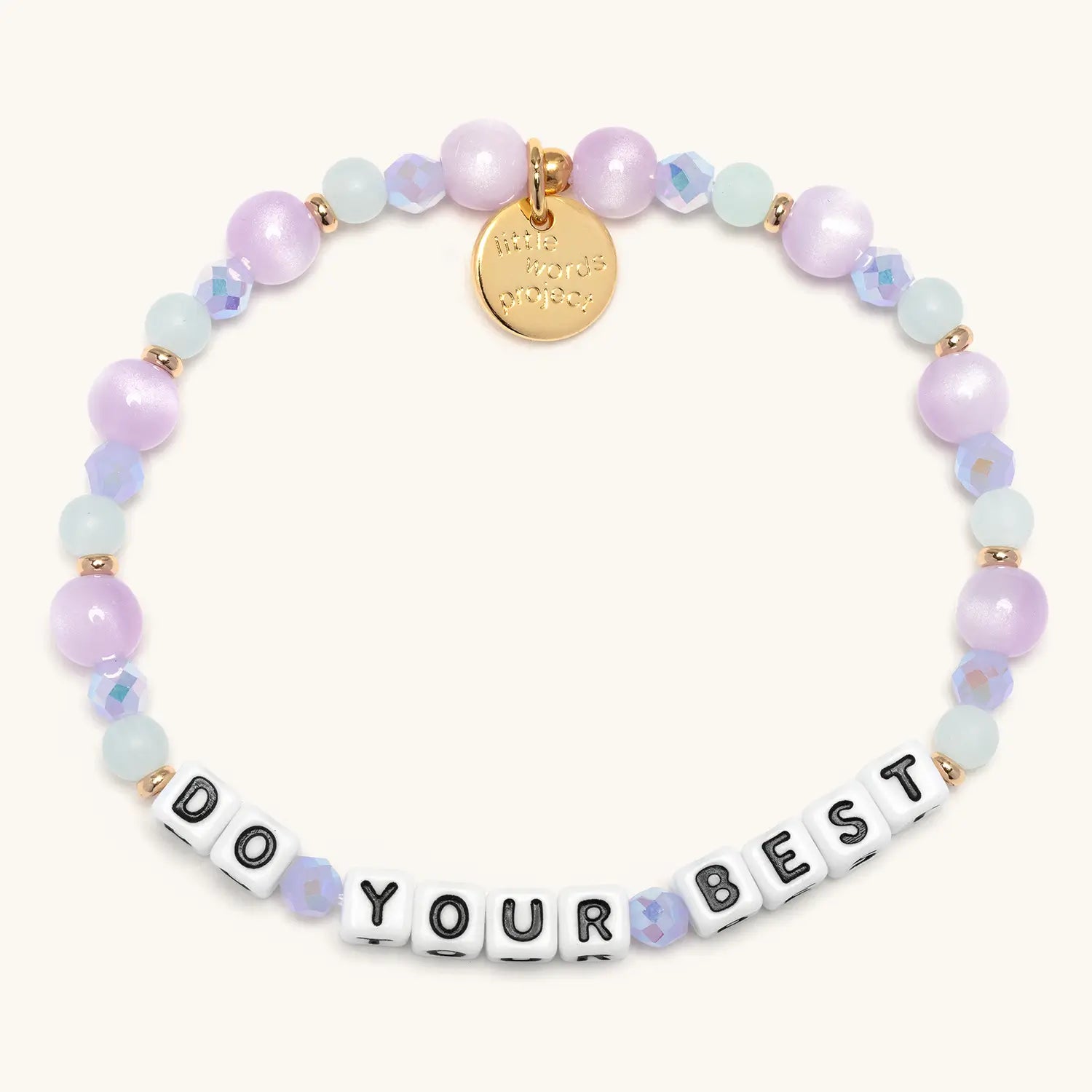 Bracelet with pastel beads and a gold tag on a white background