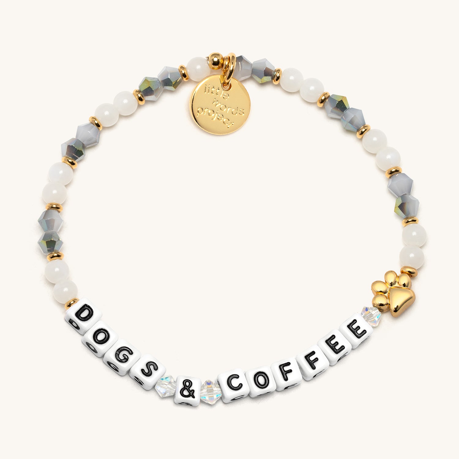 Bracelet with 'DOGS & COFFEE' and gold accents on a white background
