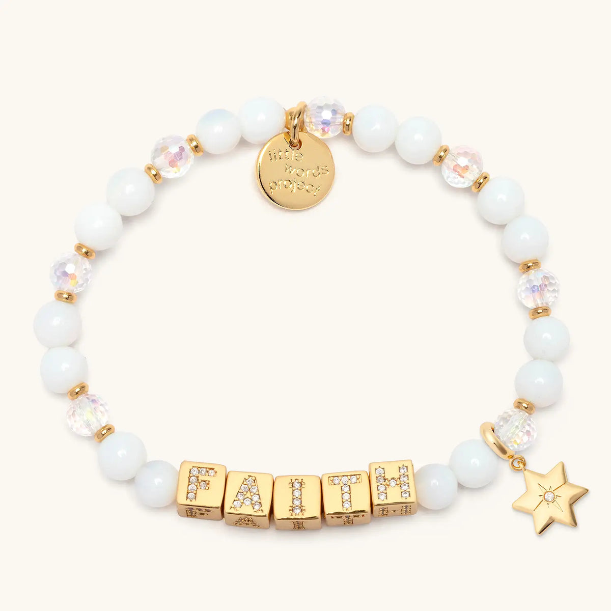 BOLDER Faith Bracelet in the Icicle Energy bead pattern with gold CZ letter blocks, gold puffy Star of David charm with a clear CZ stone, flat-lay on cream background