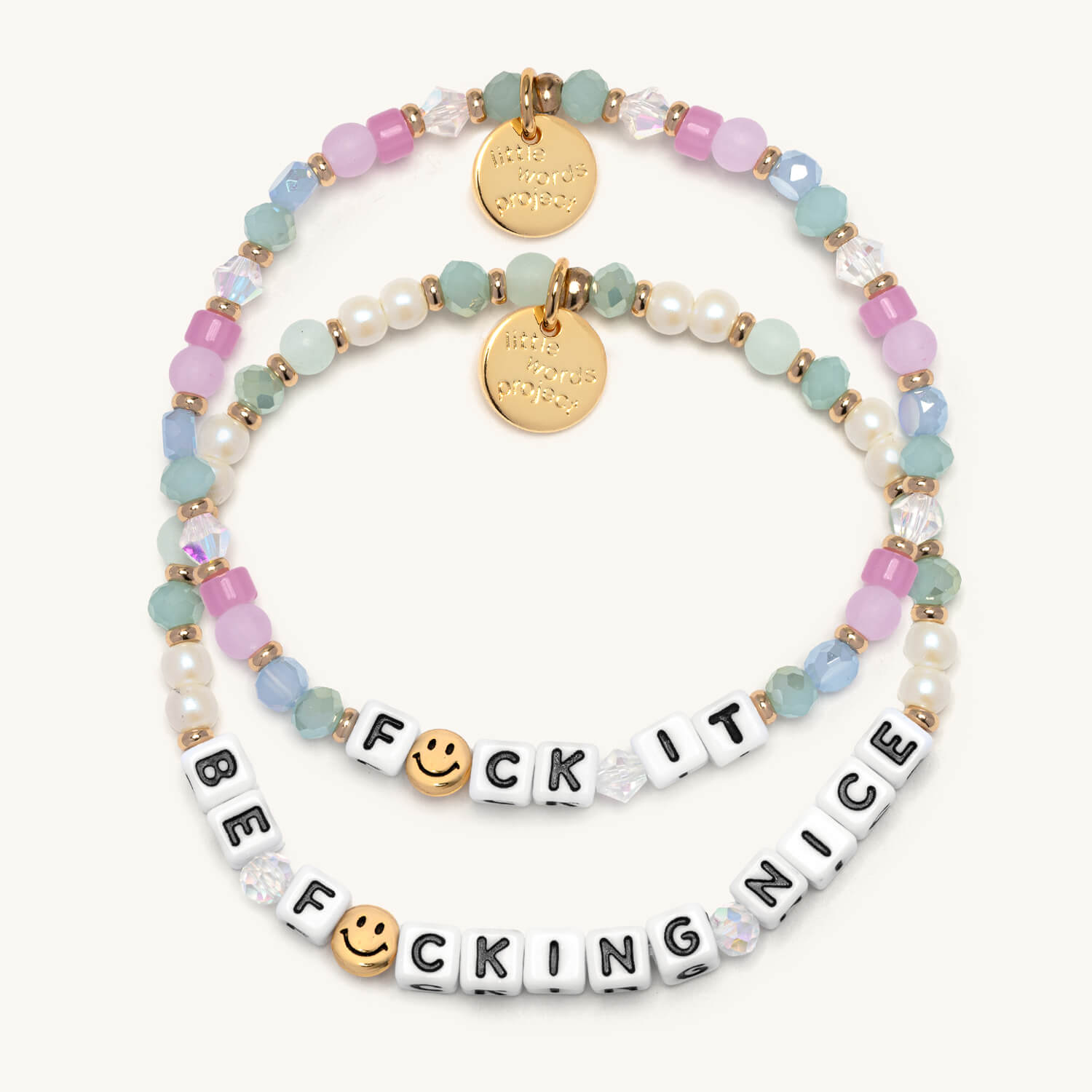 Colorful beaded bracelets with letter beads spelling out F*ck it  & Be F*cking Nice on a white background.