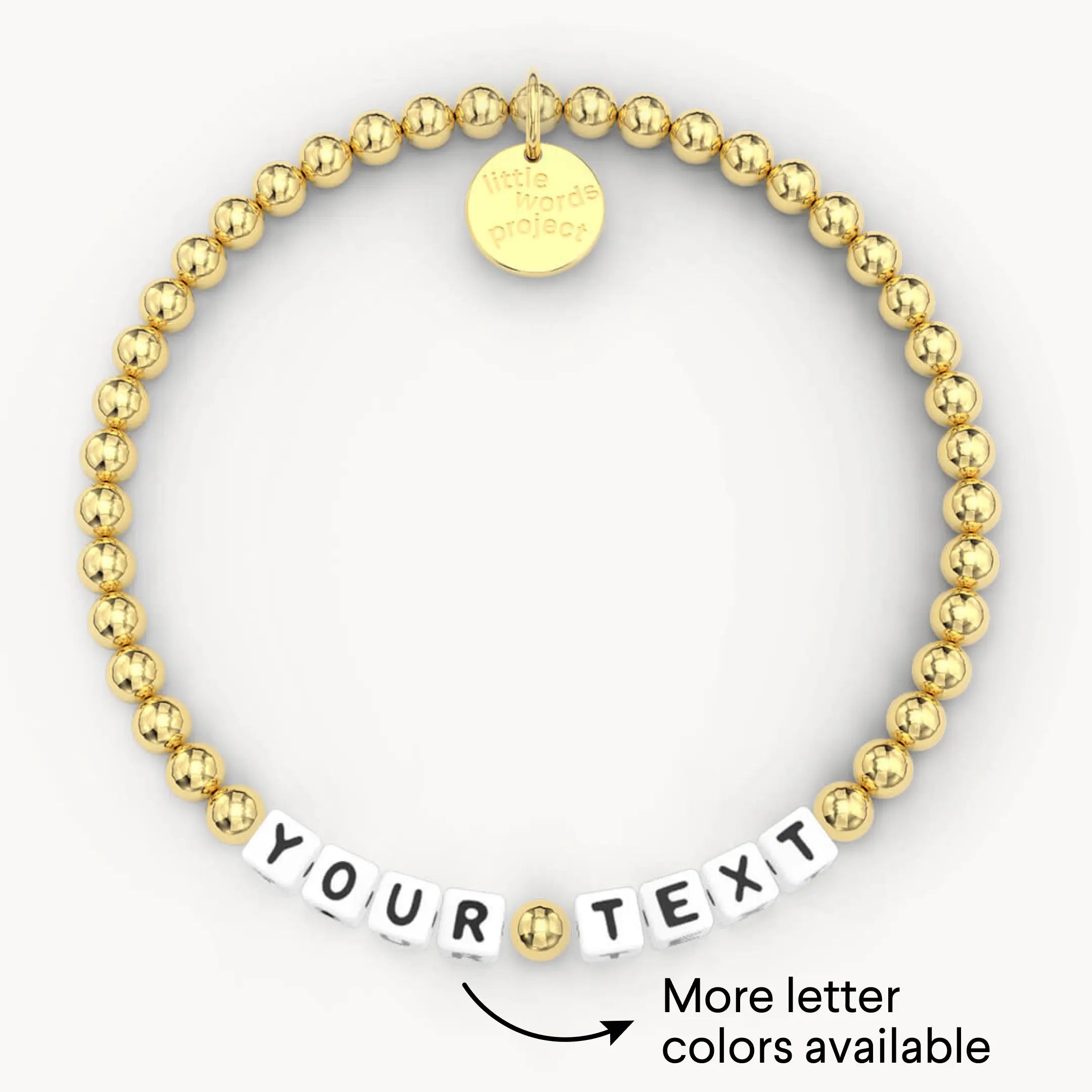 Gold beaded bracelet with customizable text charm on a white background