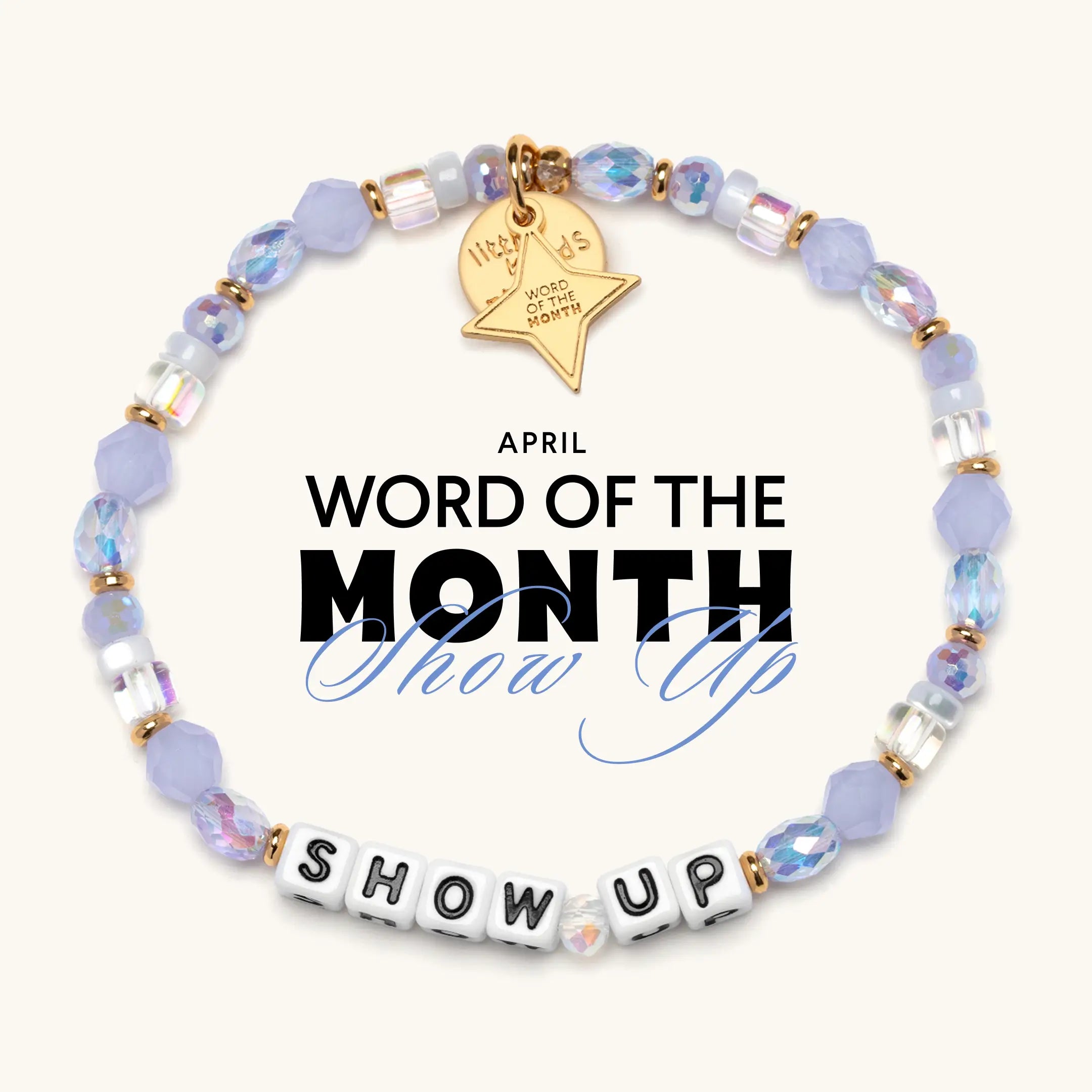 Bracelet with beads on a white background, featuring text about April's word of the month.