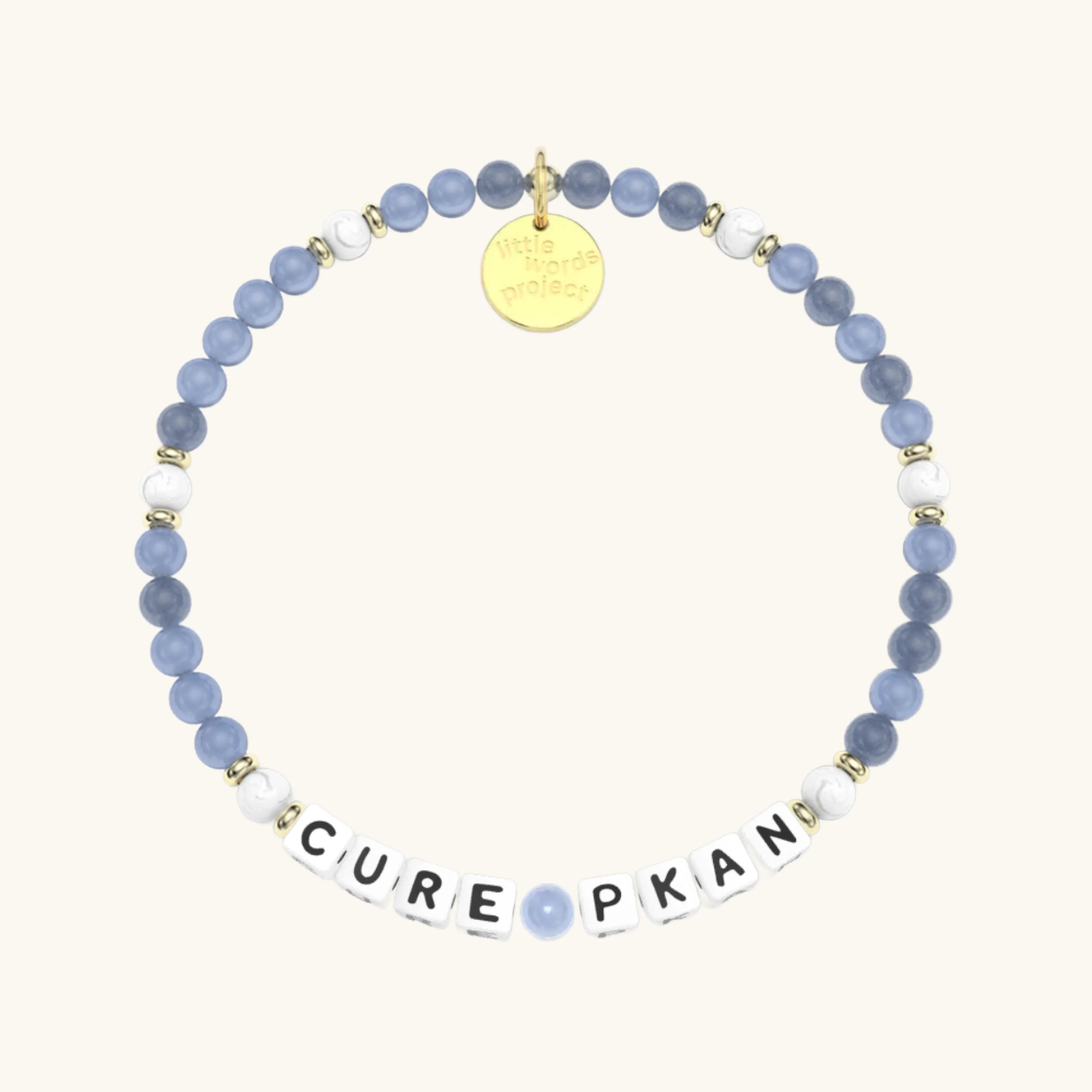 Bracelet with blue and white beads and a gold tag on a white background