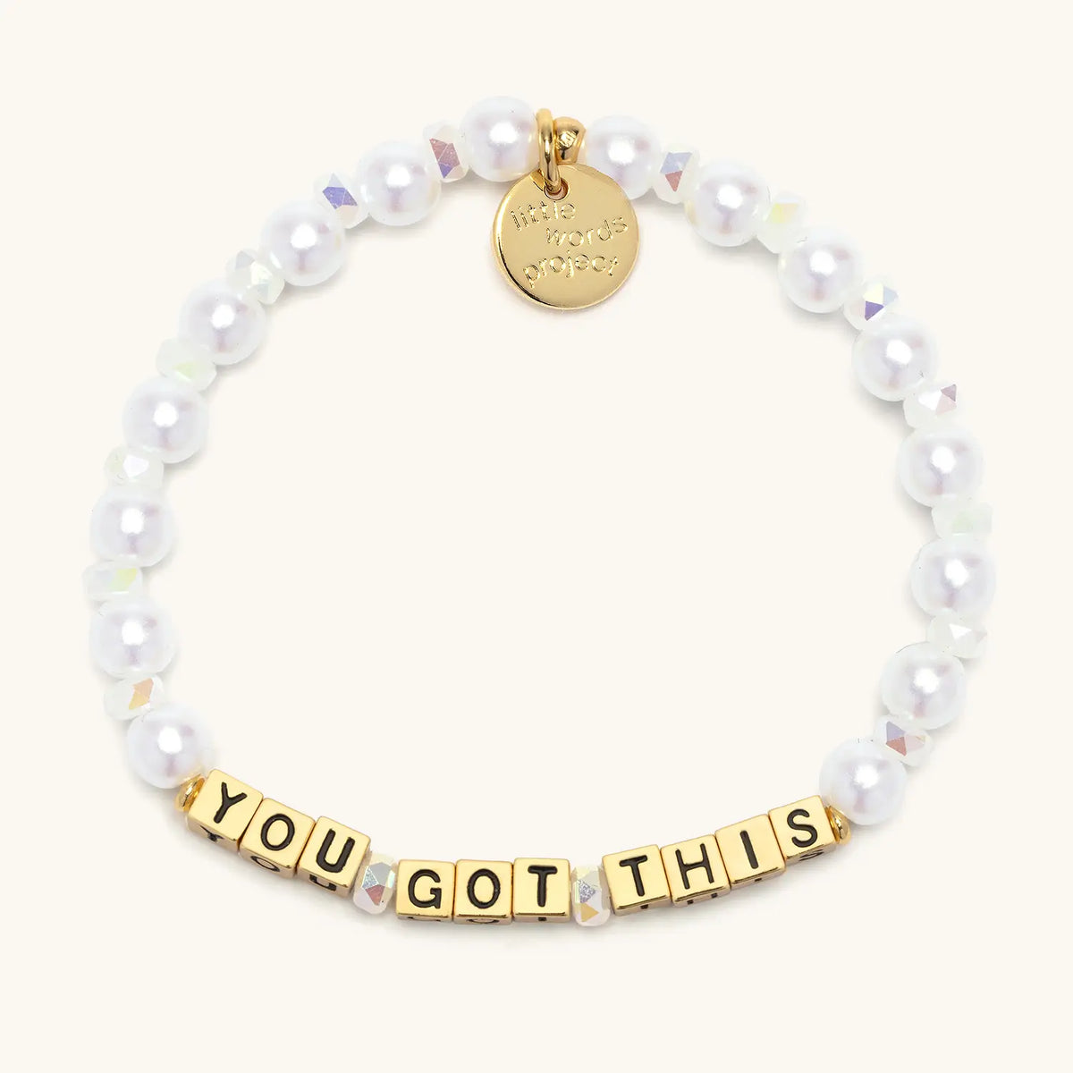You Got This bracelet with gold letter beads from the Good Things Ahead Bracelet Set, flat-lay on cream background