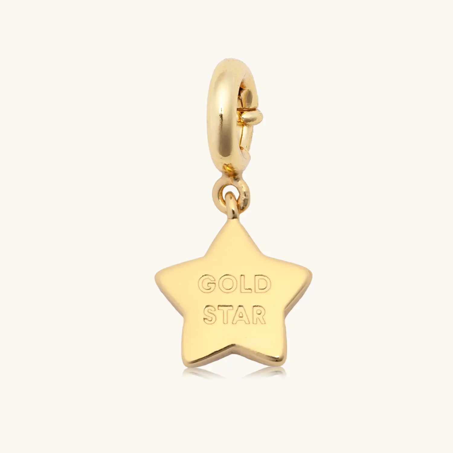 Gold Star gold plated charm, flat lay
