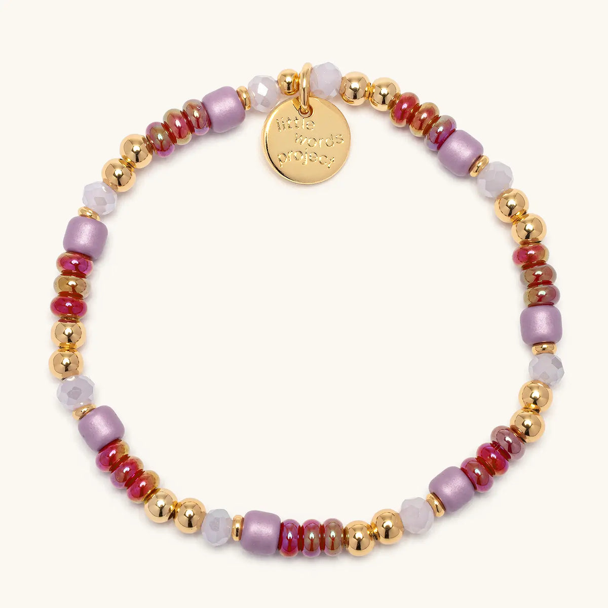 Golden Cherry Bracelet Base from the Golden Cherry Charm Bracelet set, cherry red, lilac, and gold beads, flat-lay on cream background
