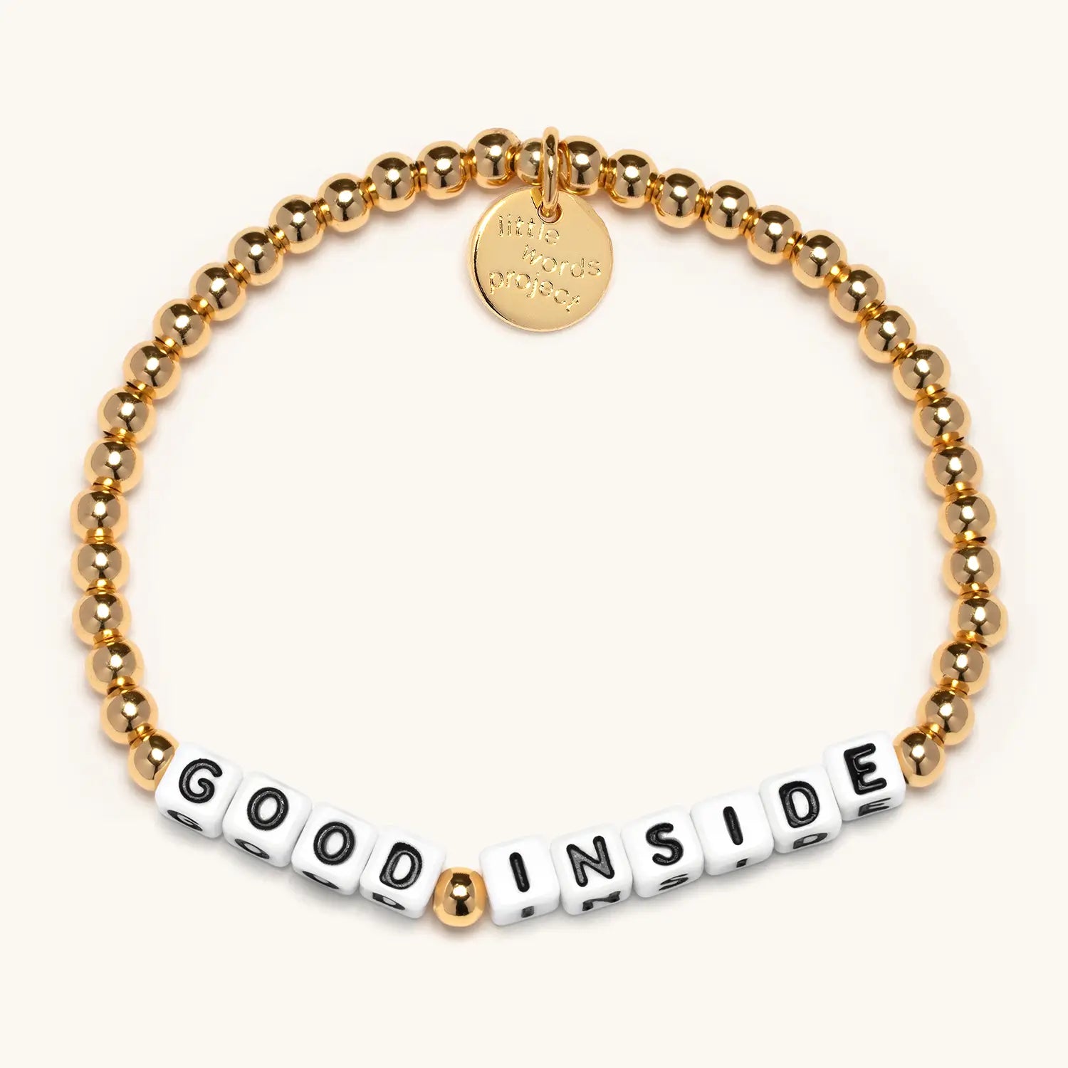 Gold beaded bracelet with 'Good Inside' on a white background
