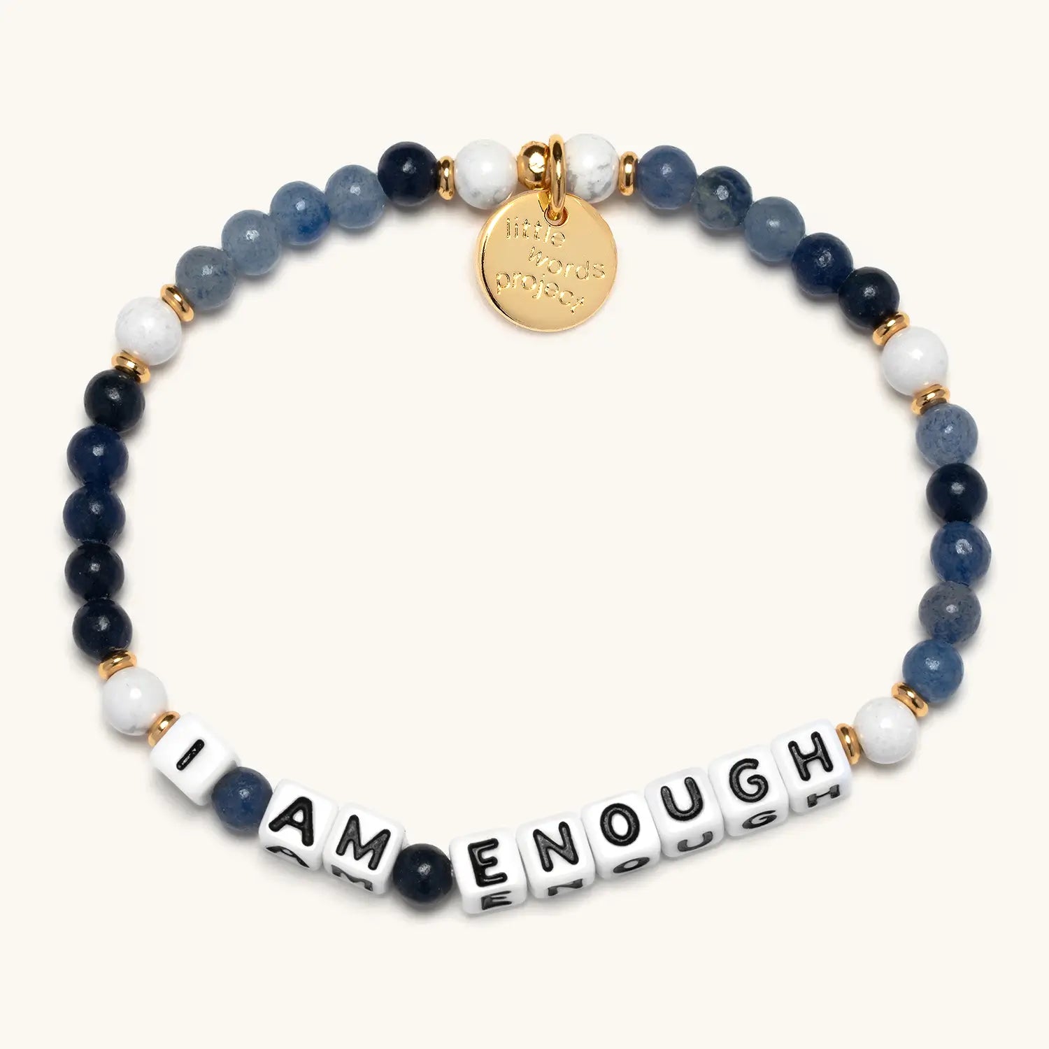 Bracelet with blue and white beads and 'I AM ENOUGH' message on a white background