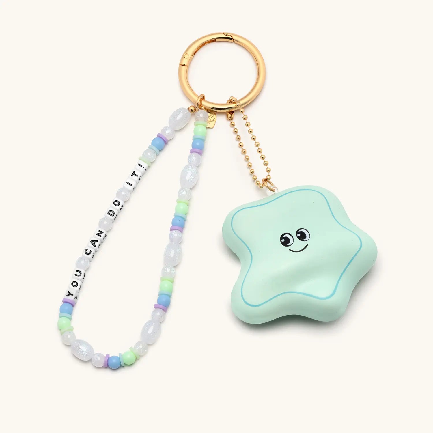 Star-shaped bag charm with smiley face on a white background