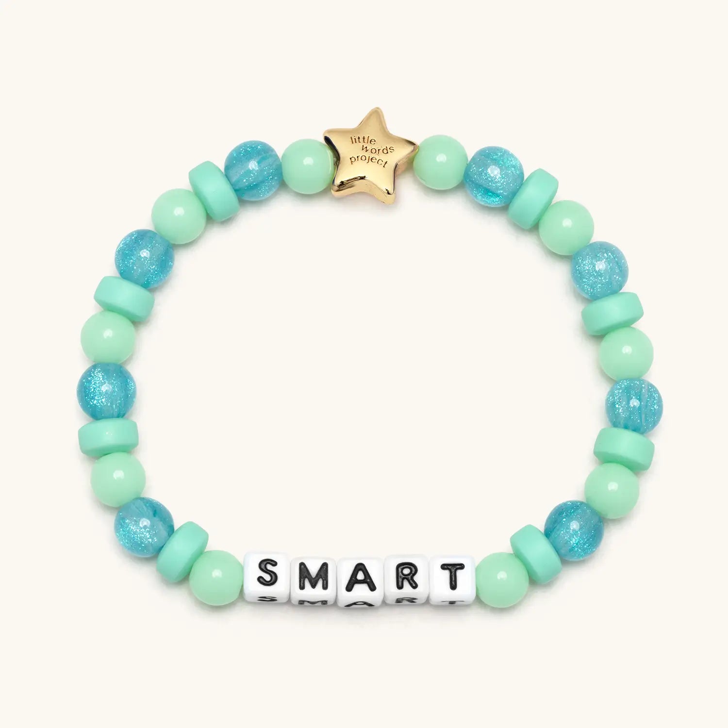 Bracelet with turquoise and green beads and a gold star tag on a white background