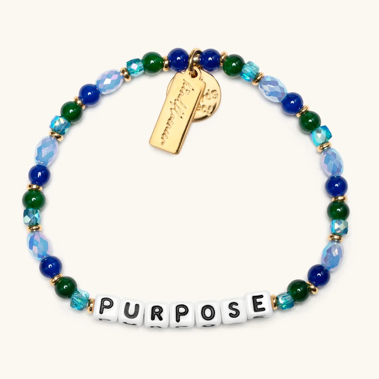 Bracelet with beads and a gold tag on a white background