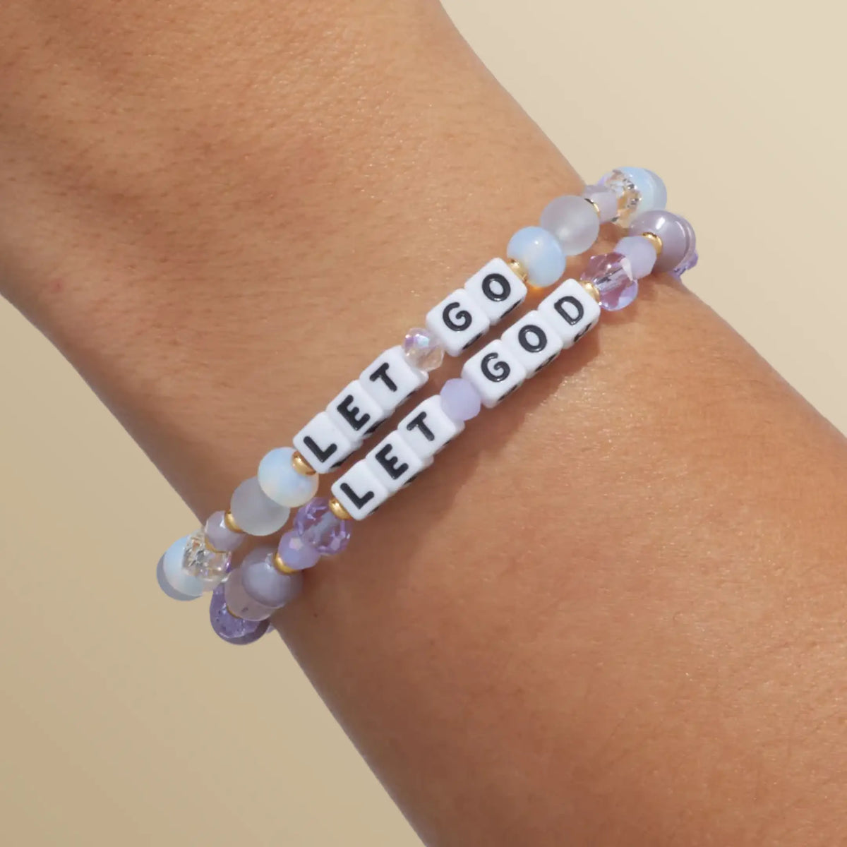 Let Go Let God Bracelet Set, Let Go and Let God bracelets stacked, on-model wrist shot on warm neutral background