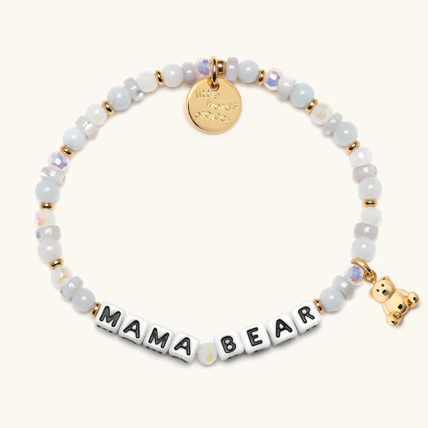 Bracelet with 'MAMA BEAR' and a gold teddy bear charm on a white background