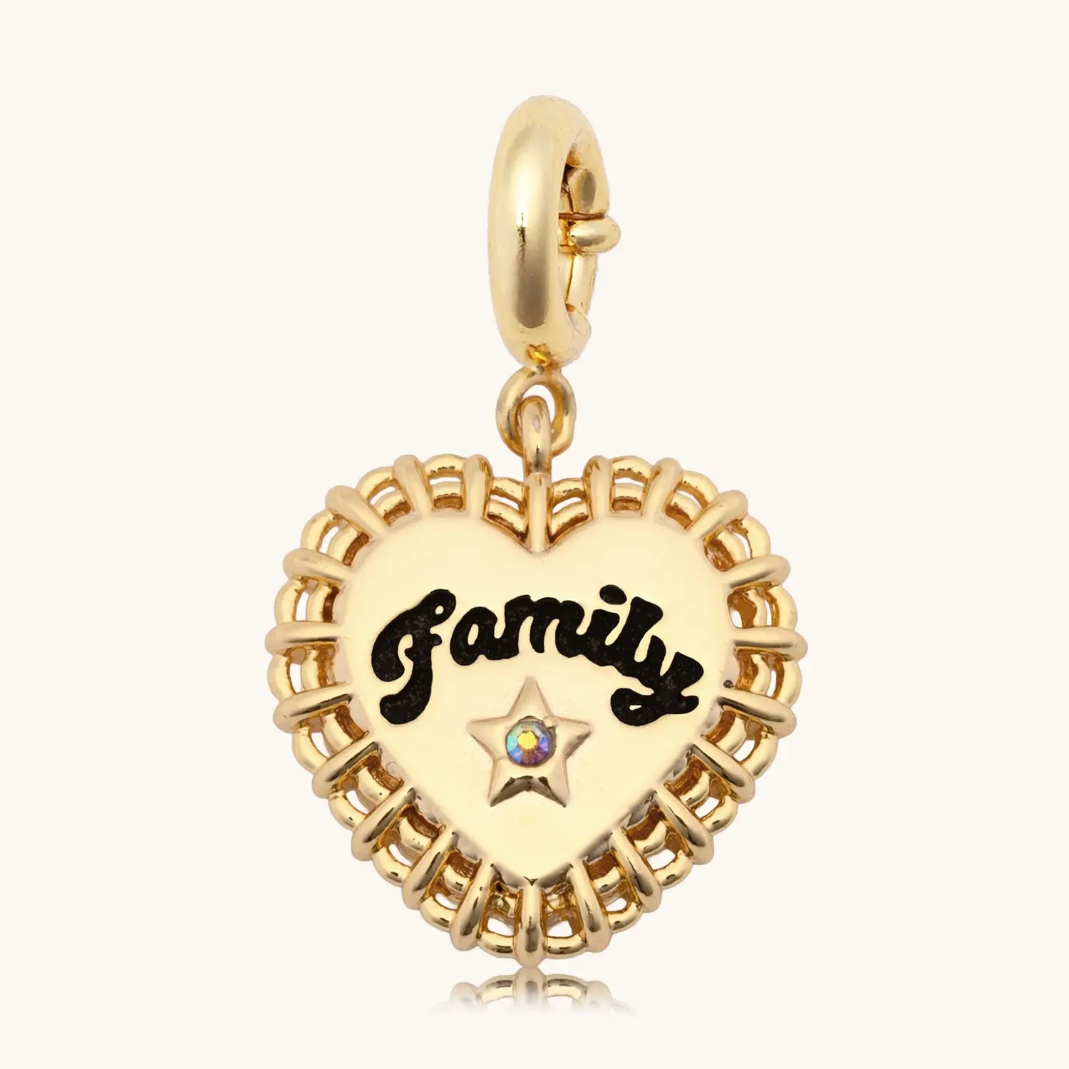 Gold heart-shaped charm with Family text blazoned across the body set against white background