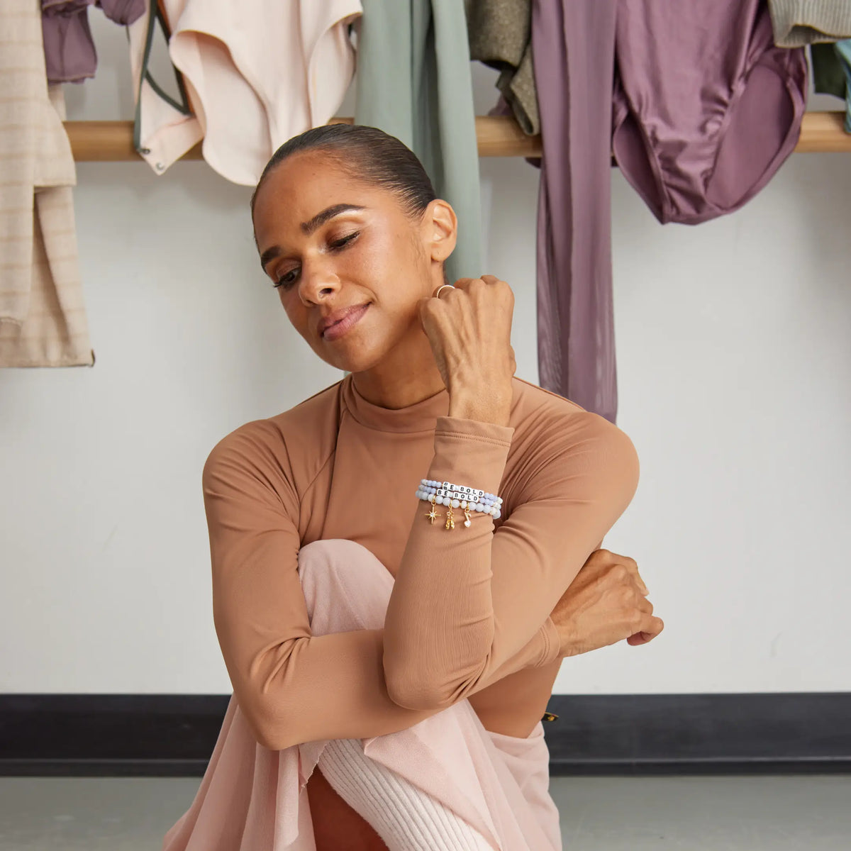 Misty Copeland wearing the Be Bold and Swan Lake bracelets in the studio