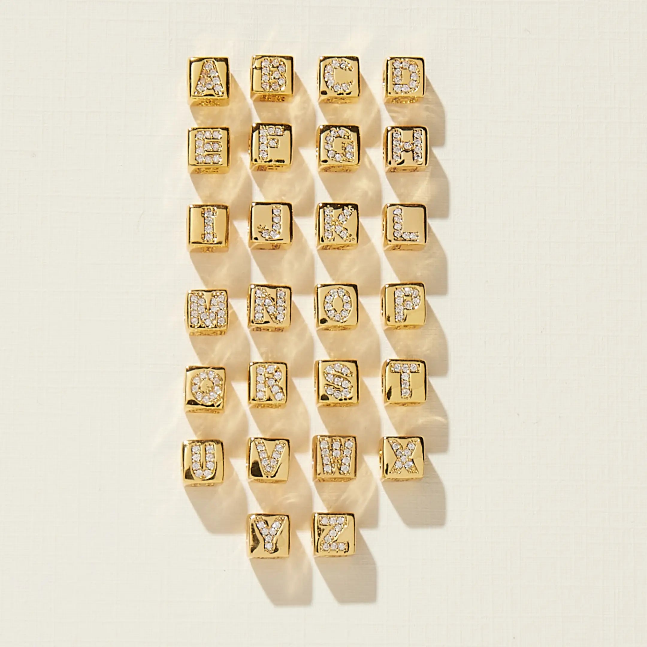 Gold letters on a beige background