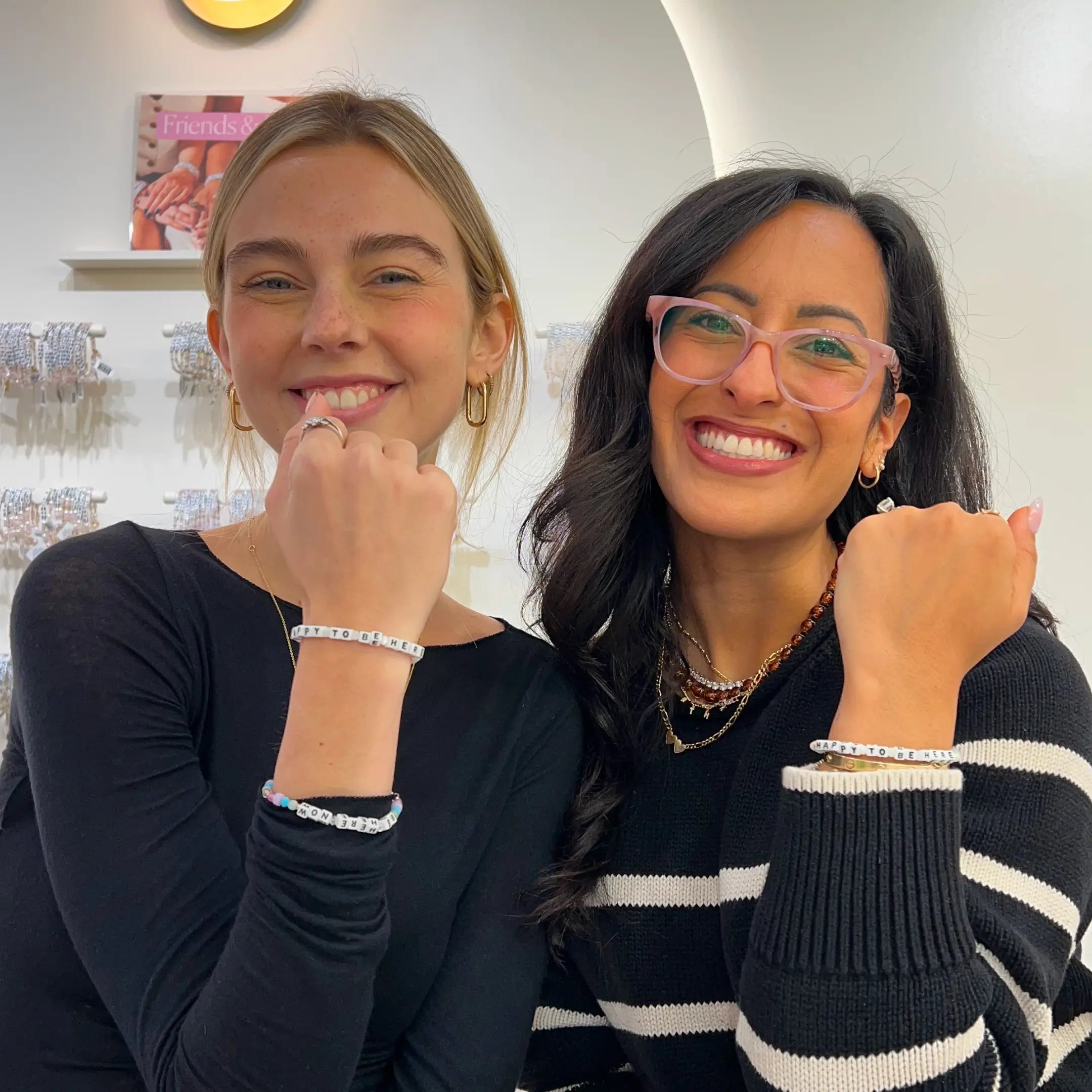 Syd Towle and Adriana Carrig wearing the Happy To Be Here bracelet
