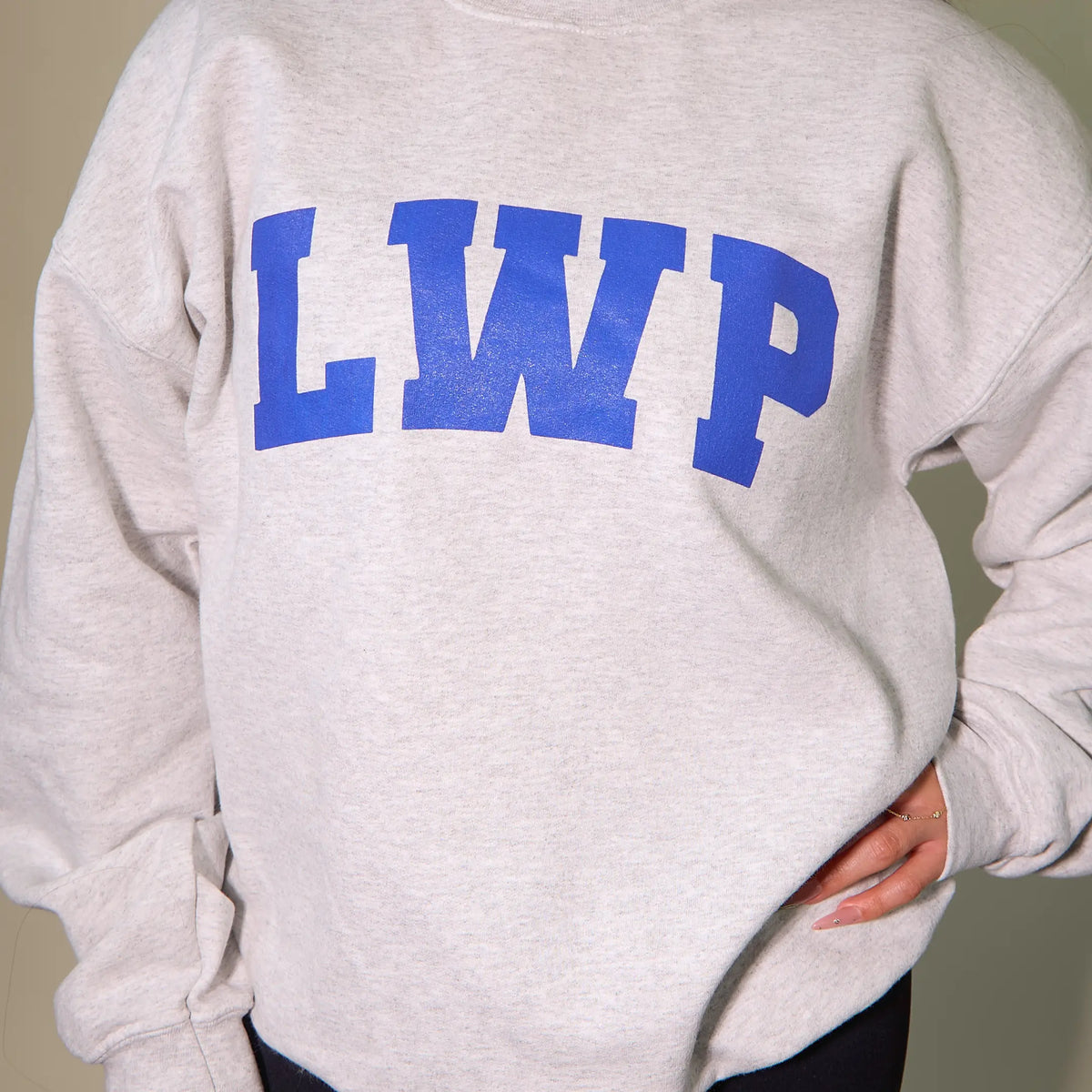 LWP gray sweatshirt folded detail view on a white background