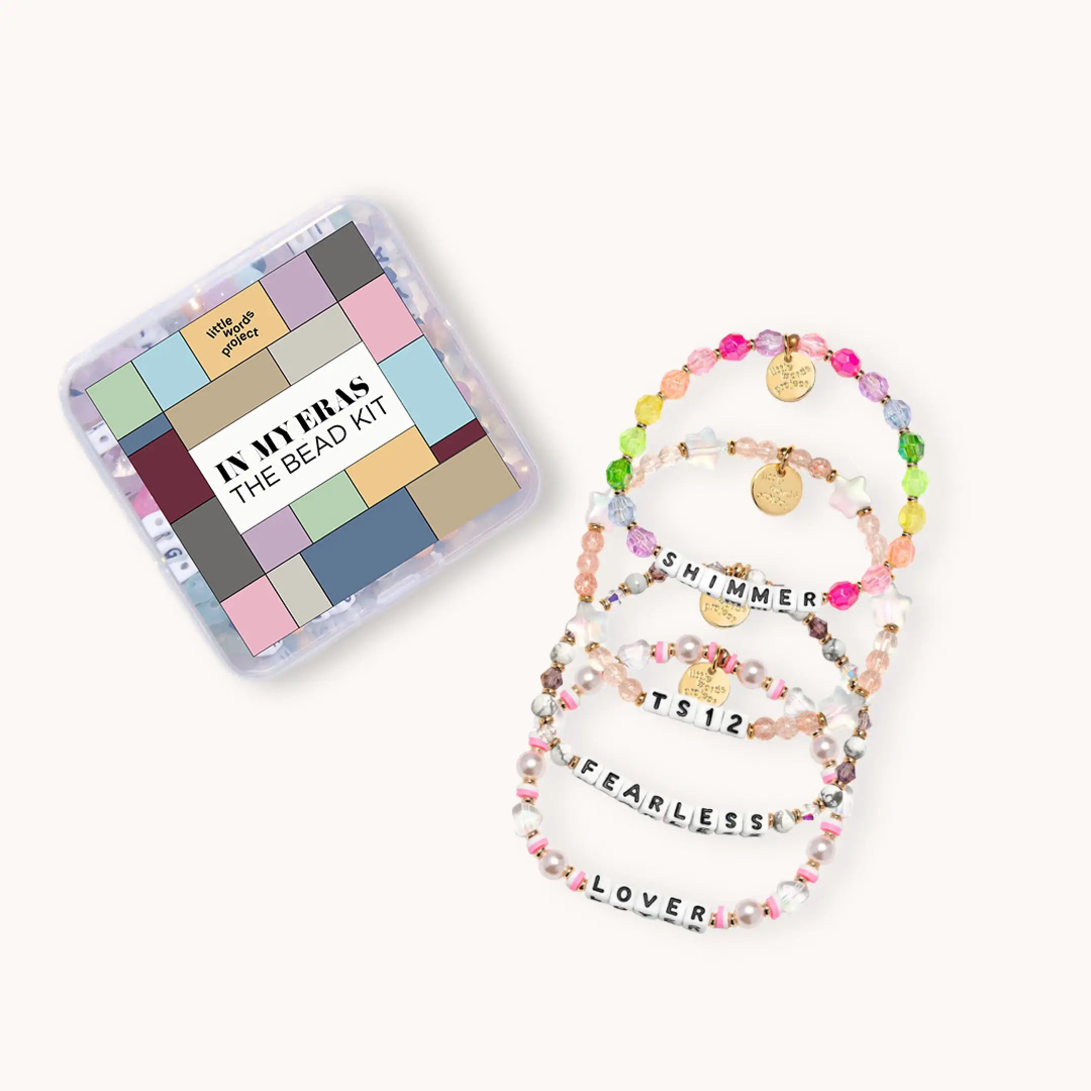 Bead kit with colorful bracelets and a box labeled 'In My Ears The Bead Kit' on a white background.