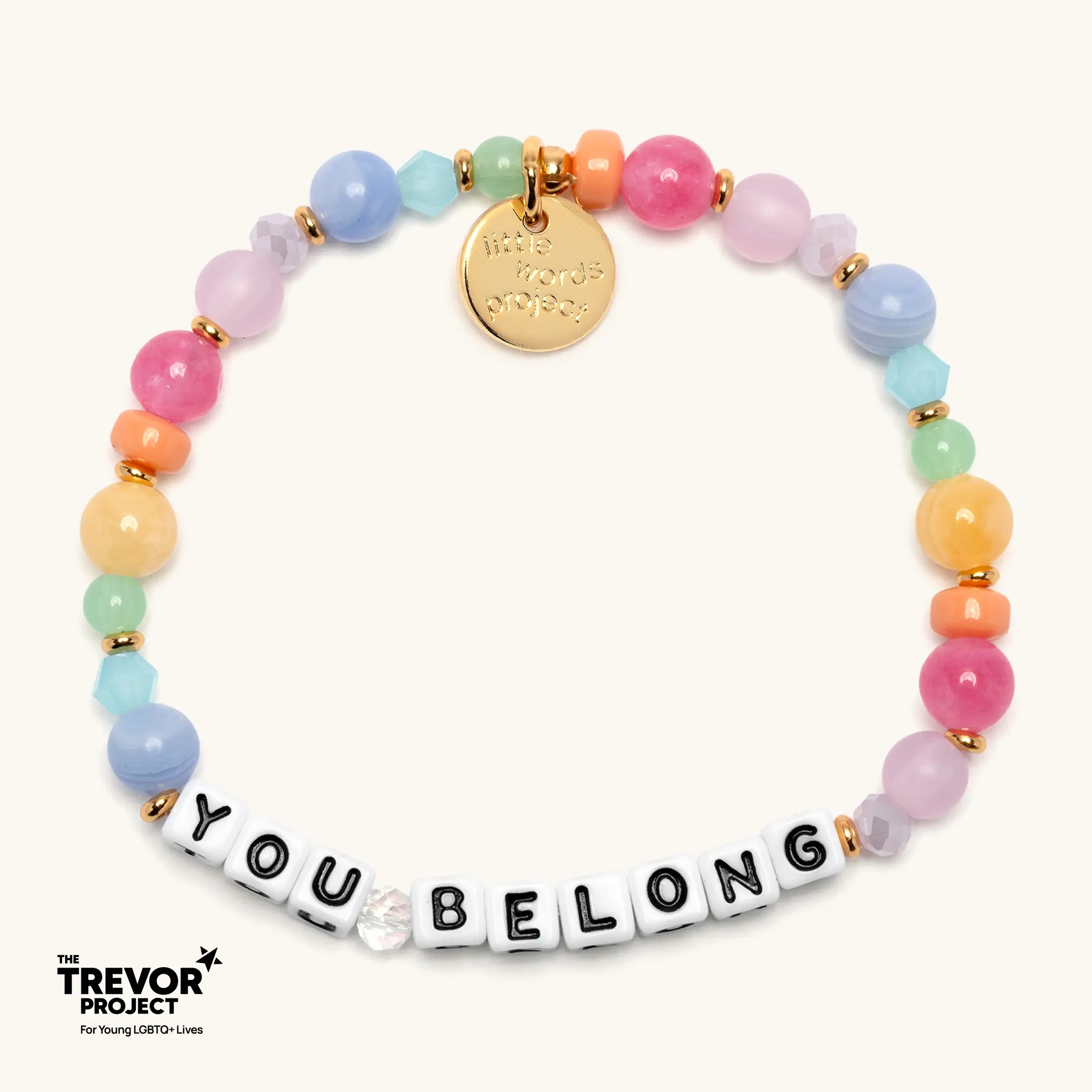 Colorful beaded bracelet with 'YOU BELONG' message on a white background, featuring The Trevor Project logo.
