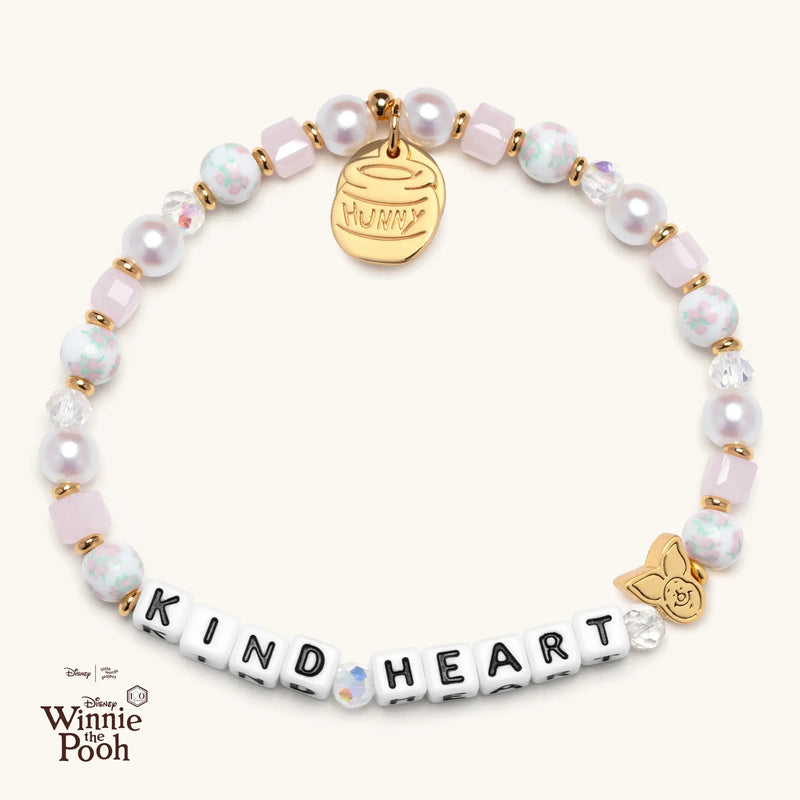 Bracelet with 'KIND HEART' beads and gold tags on a white background, featuring Disney Winnie the Pooh logo.