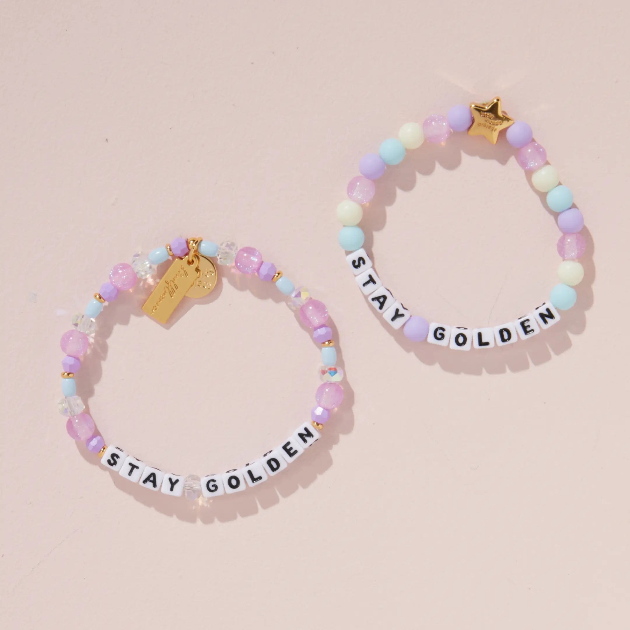 Stay Golden Bracelet Set Rylee Ta adult and kids bracelets with white letter beads styled together on a blush pink background
