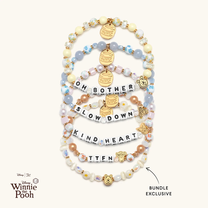 Set of Winnie the Pooh-themed bracelets on a white background