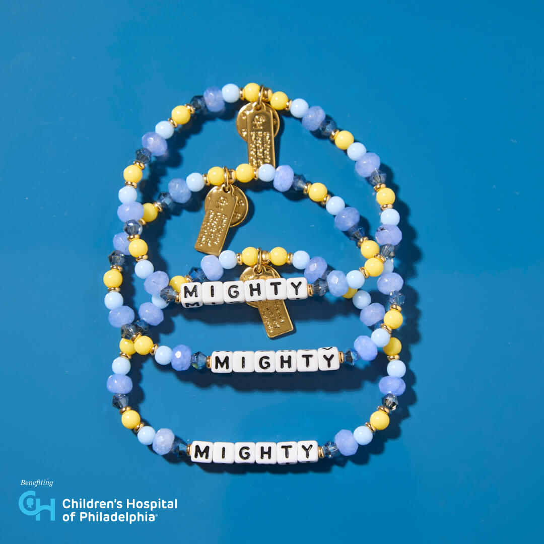 Bracelet with 'MIGHTY' charms on a blue background, benefiting Children's Hospital of Philadelphia.