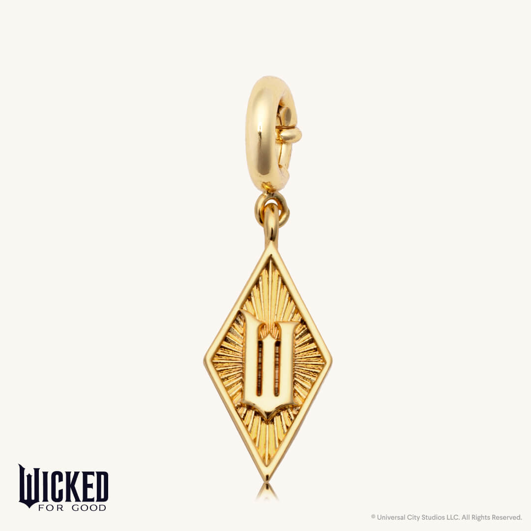Gold pendant with letter 'W' on a white background, branded 'Wicked for Good'.