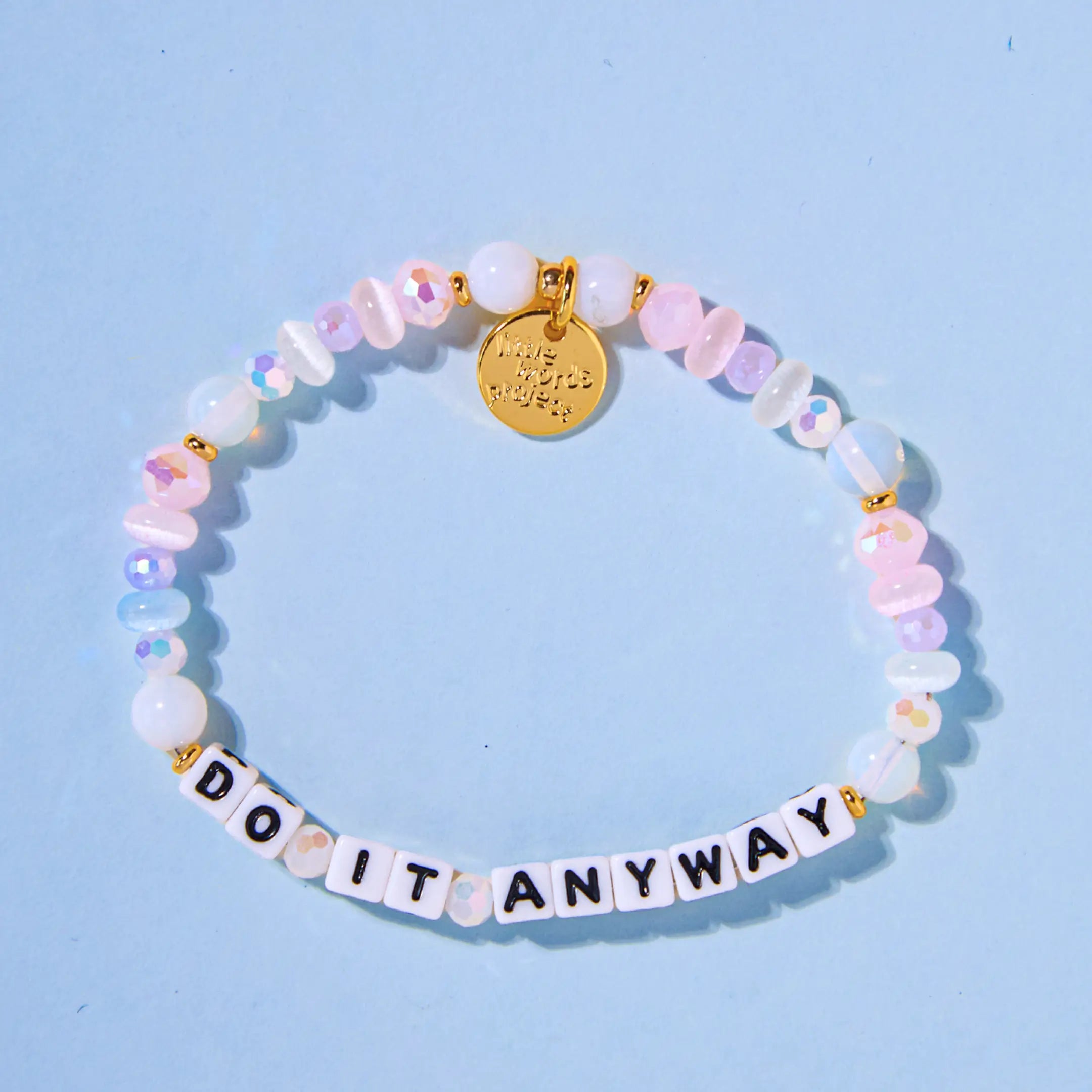 Do It Anyway — on-model shot of beaded word bracelet stacked on wrist