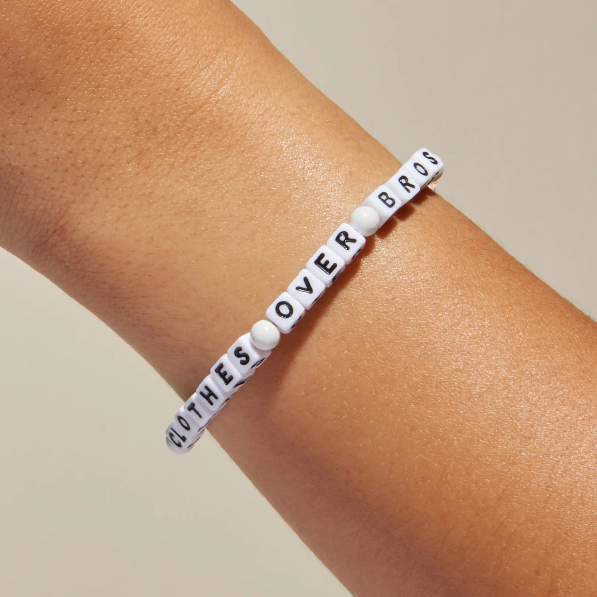 Clothes Over Bros bracelet worn on wrist