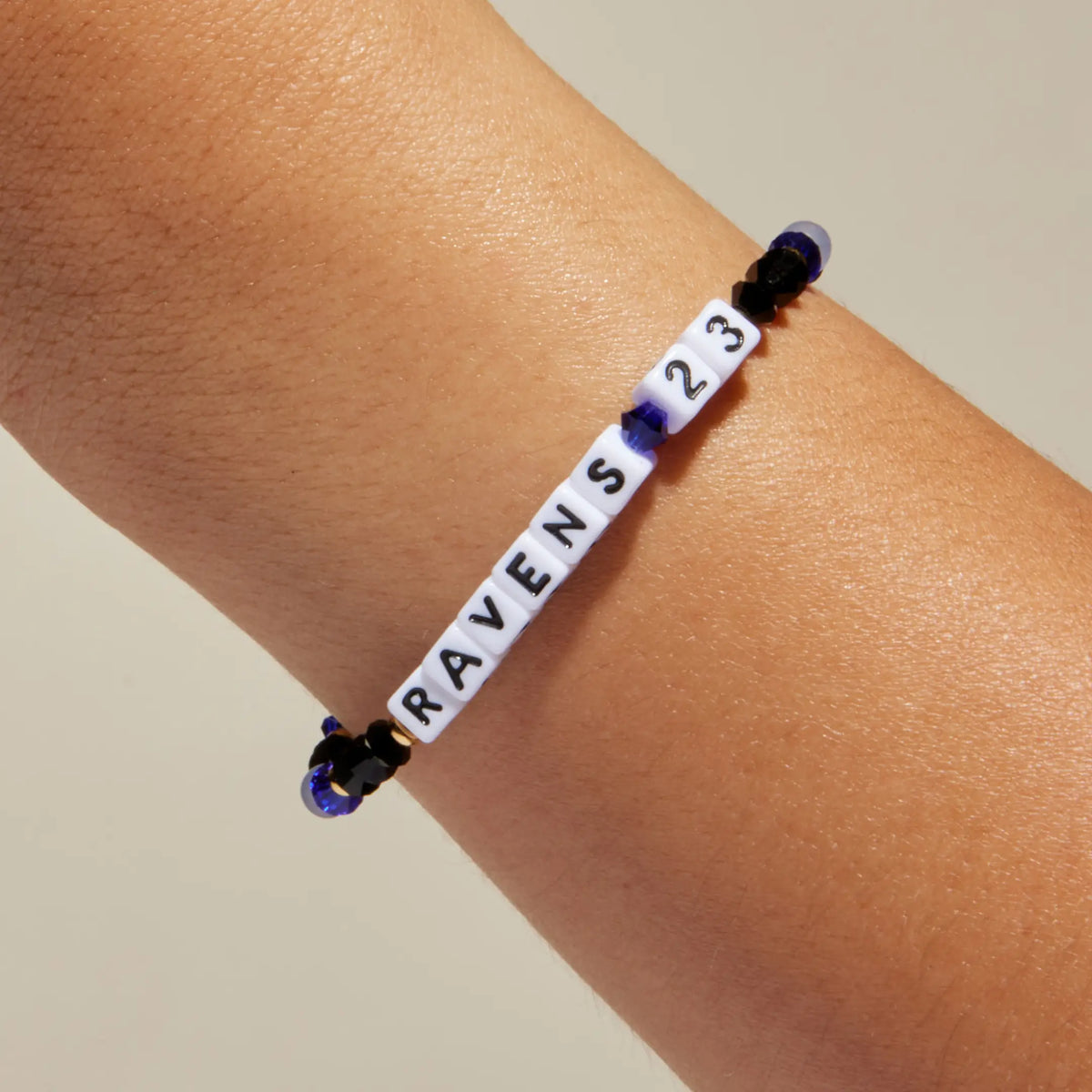 Ravens 23 bracelet worn on wrist