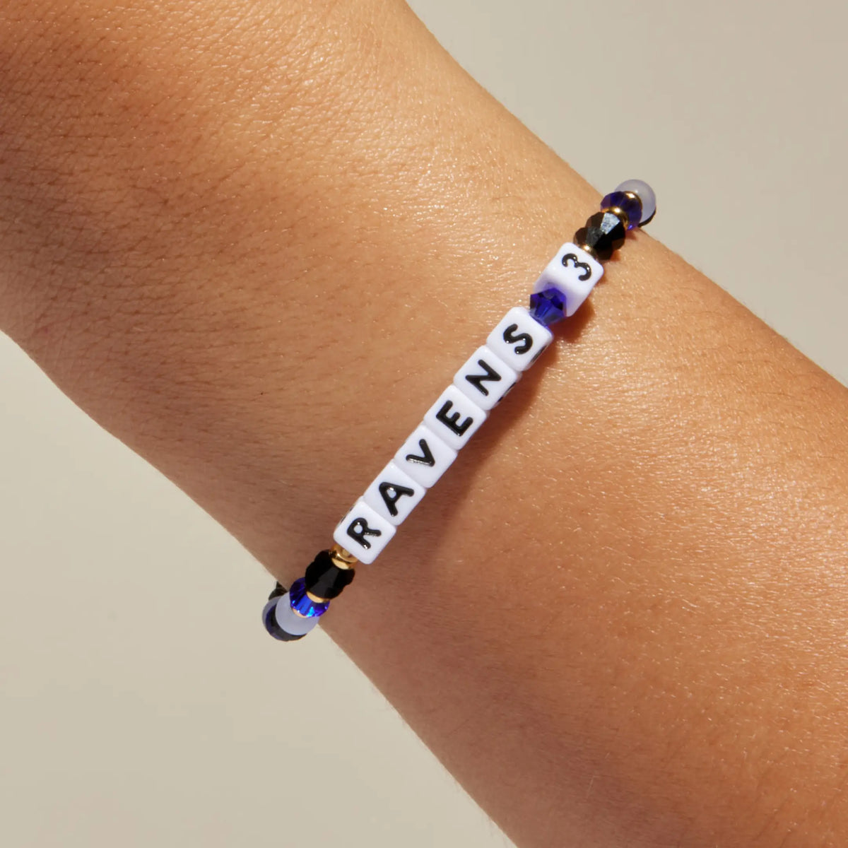 Ravens 3 bracelet worn on wrist