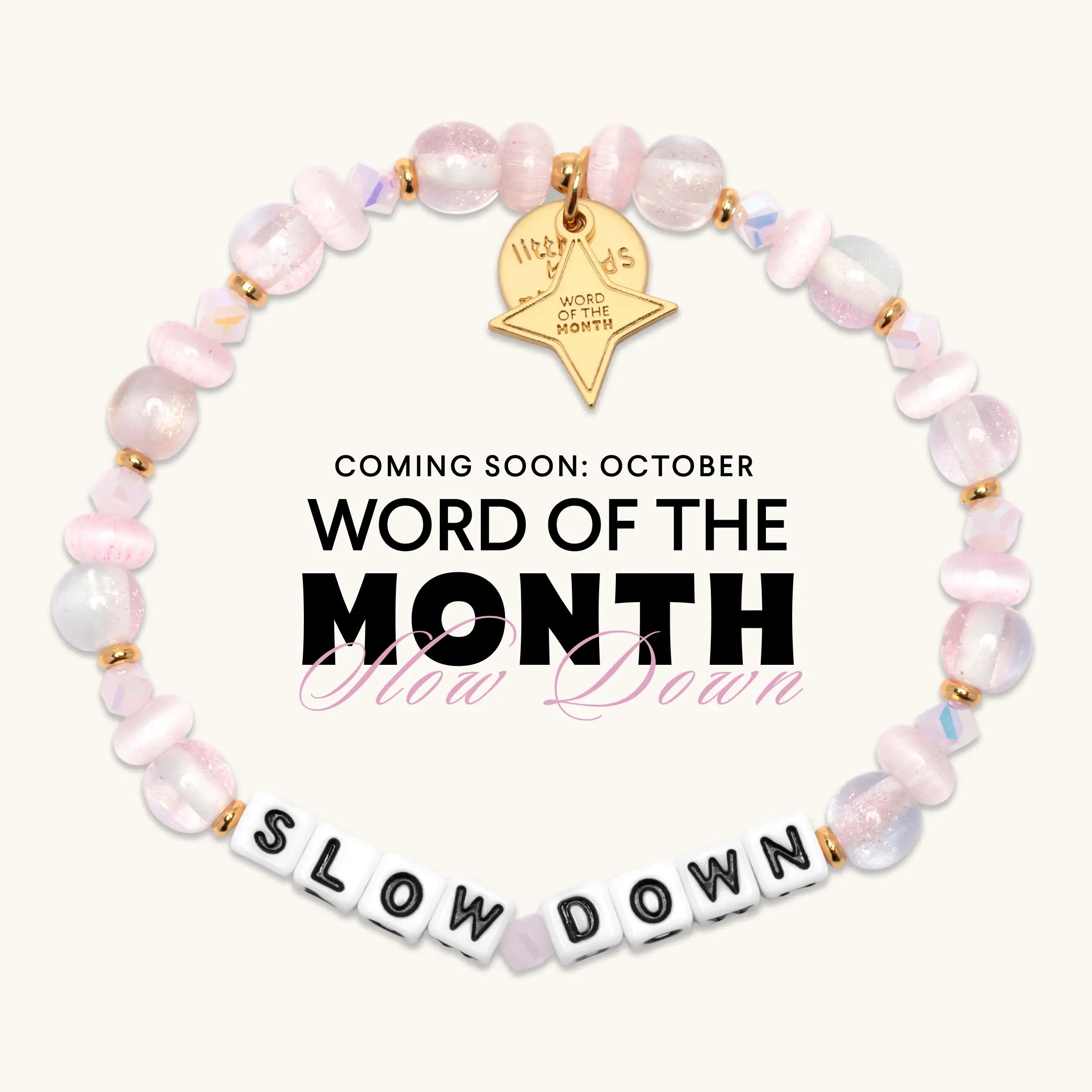 Coming soon, the Slow Down October Word of the Month bracelet with white letter beads, iridescent pink and pearl beads, and a gold Word of the Month star charm