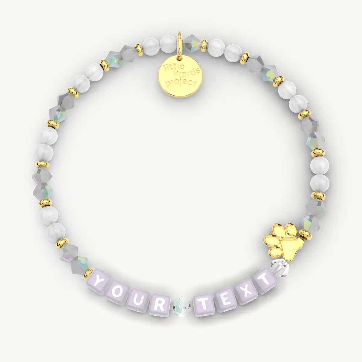 Personalized beaded bracelet with gold accents and 'YOUR TEXT' message on a white background